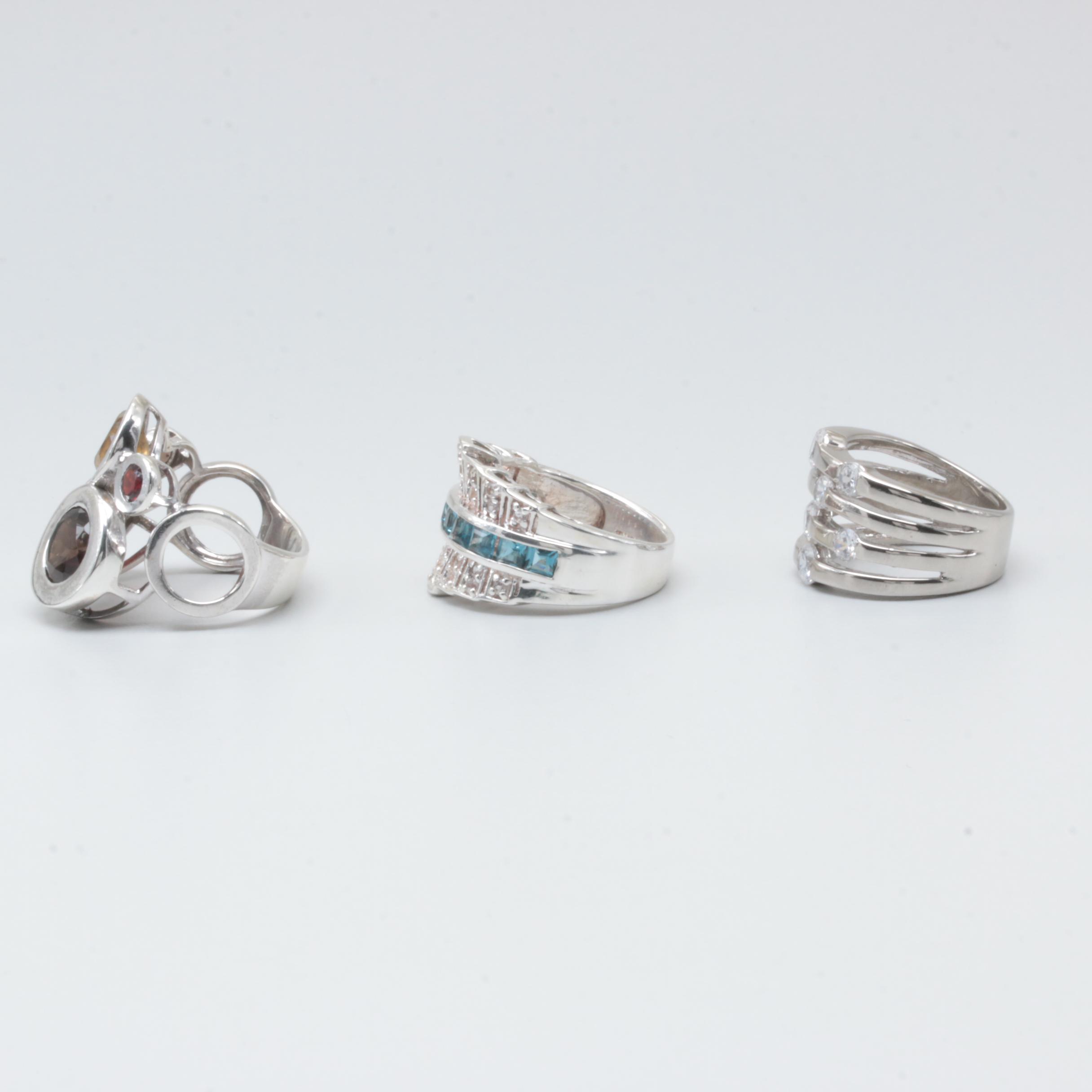 Sterling Silver Rings Including Garnet, Citrine, and Blue Topaz