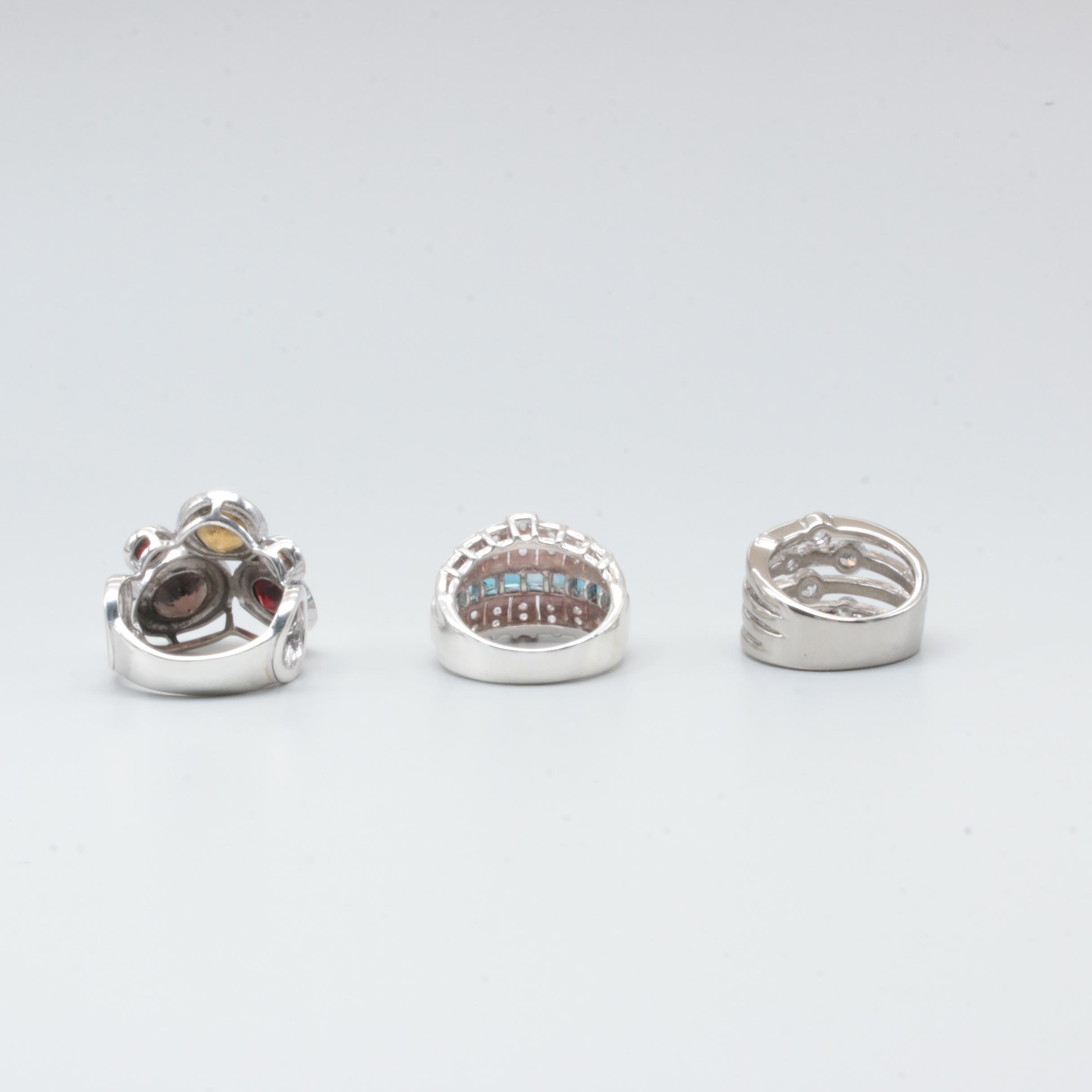 Sterling Silver Rings Including Garnet, Citrine, and Blue Topaz