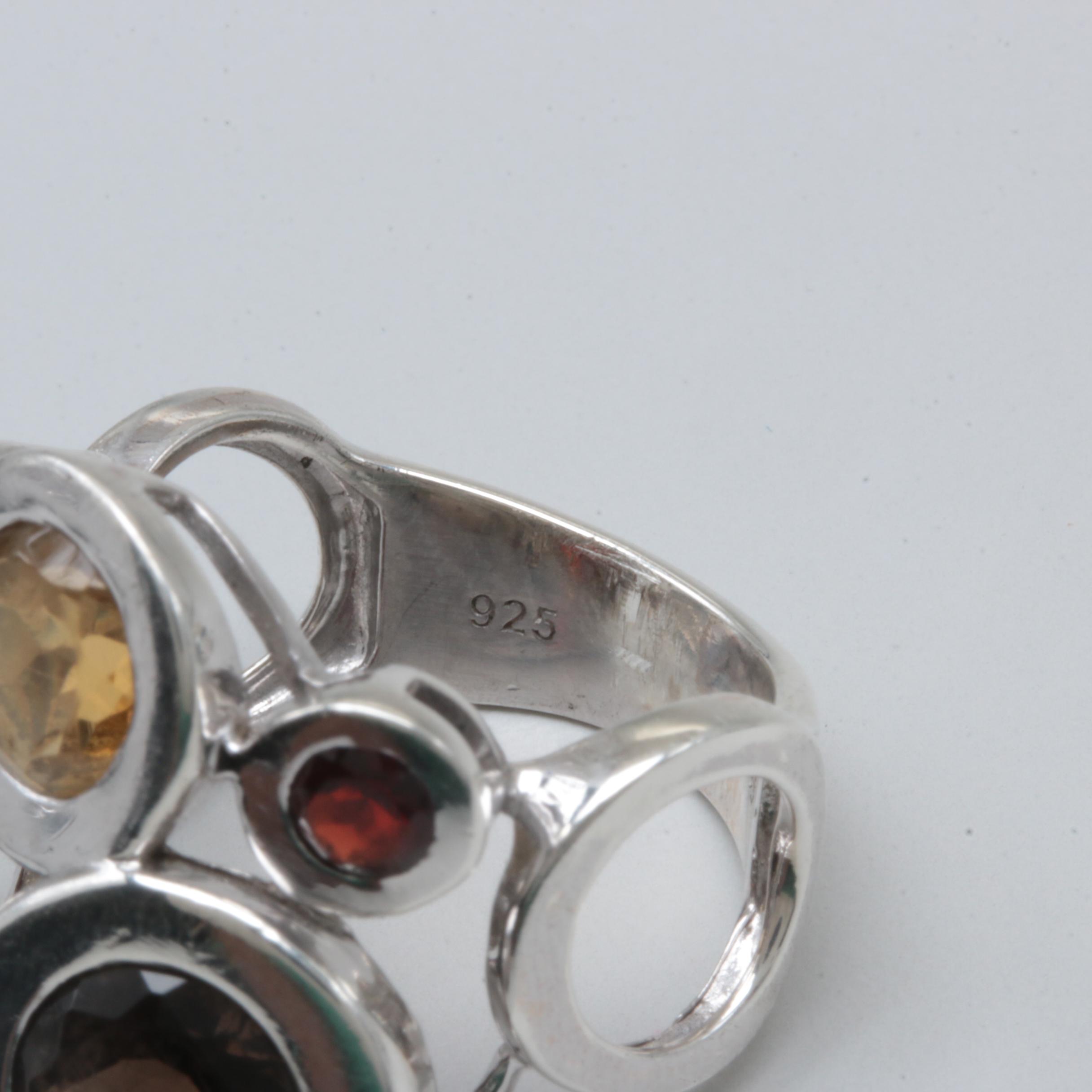 Sterling Silver Rings Including Garnet, Citrine, and Blue Topaz