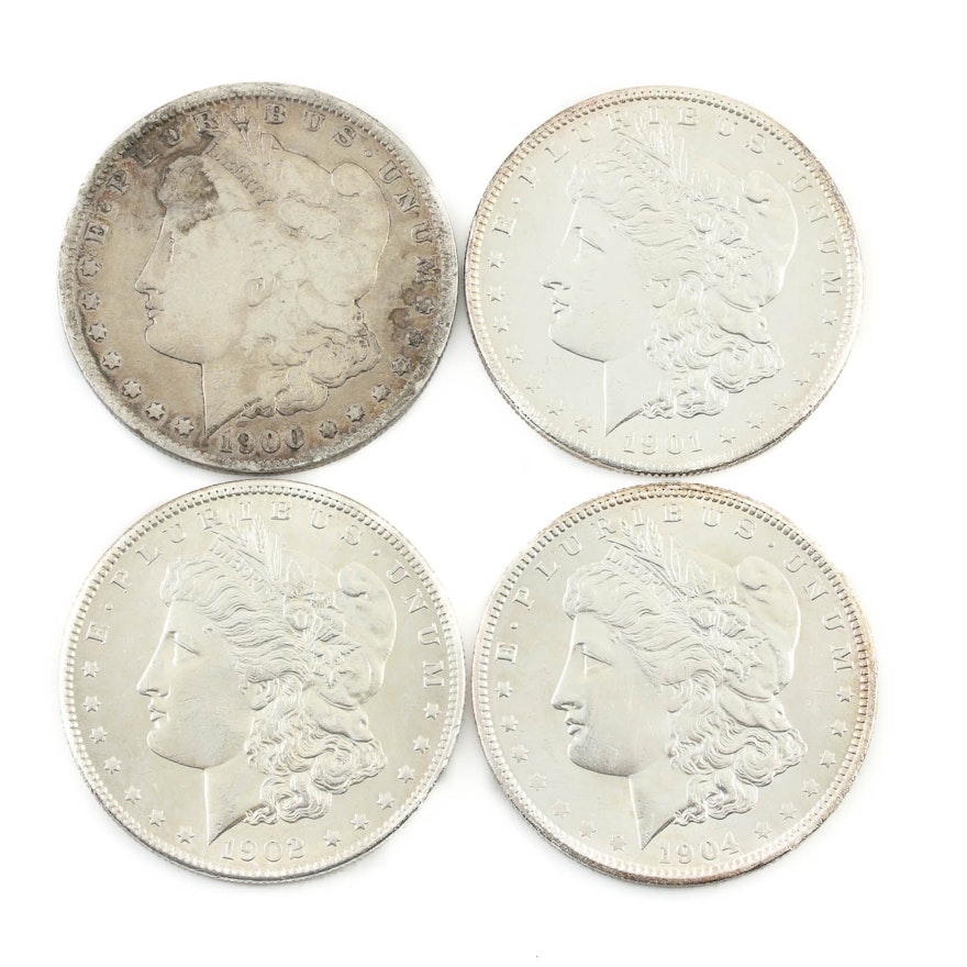 Group of Four Silver Morgan Dollars