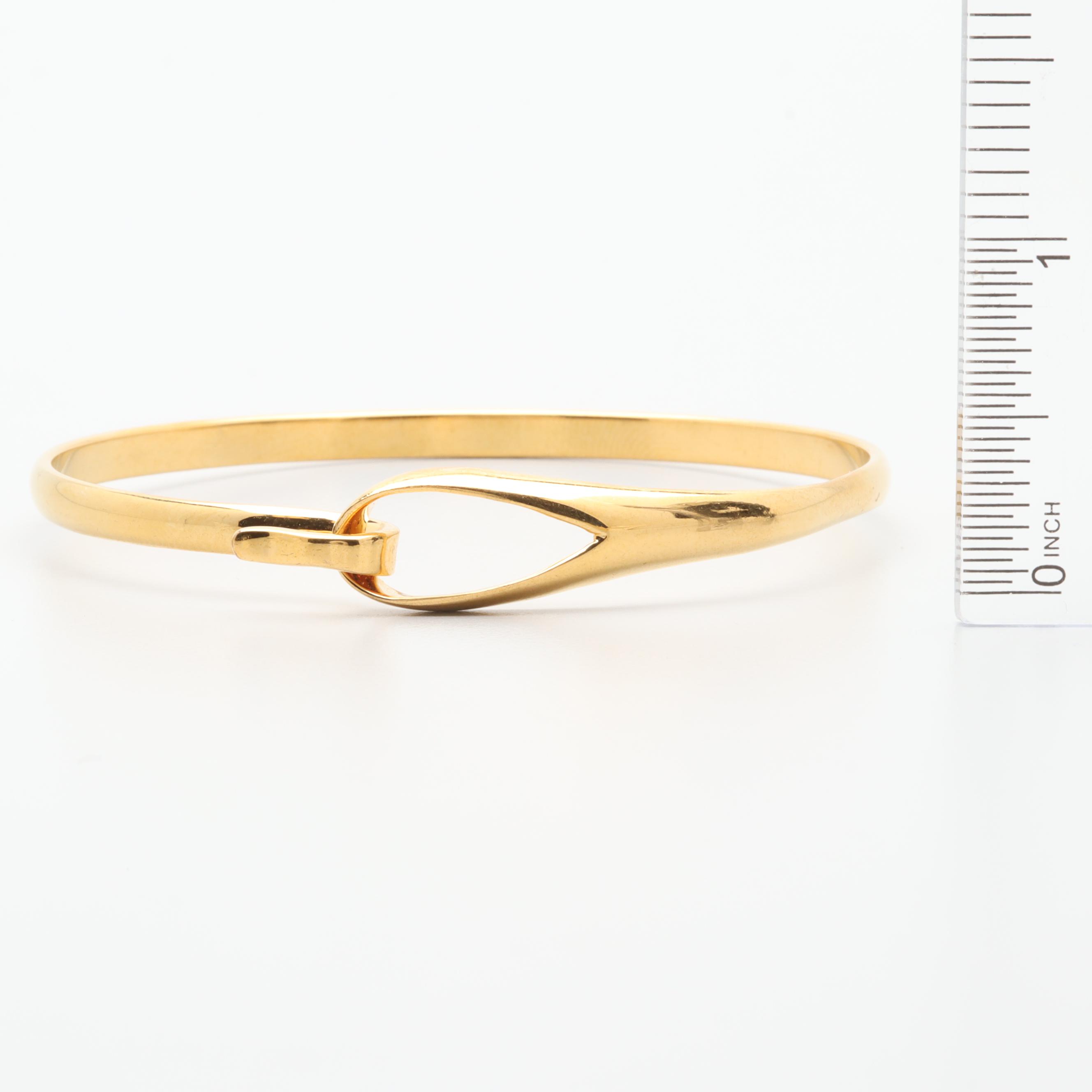 Gold Tone Necklace and Bracelets Featuring Tory Burch and Diane Von Furstenburg