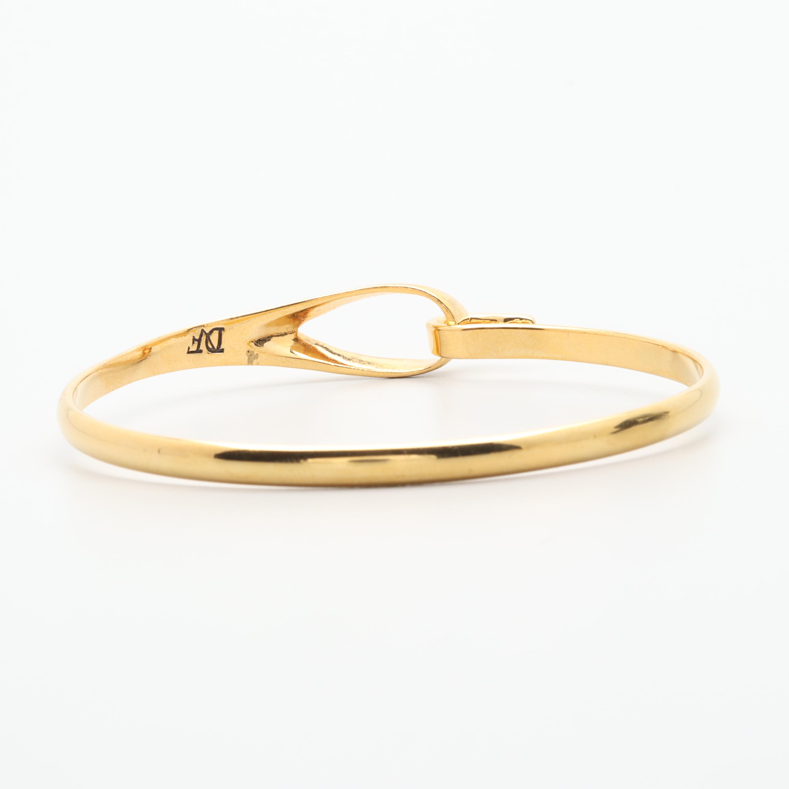 Gold Tone Necklace and Bracelets Featuring Tory Burch and Diane Von Furstenburg