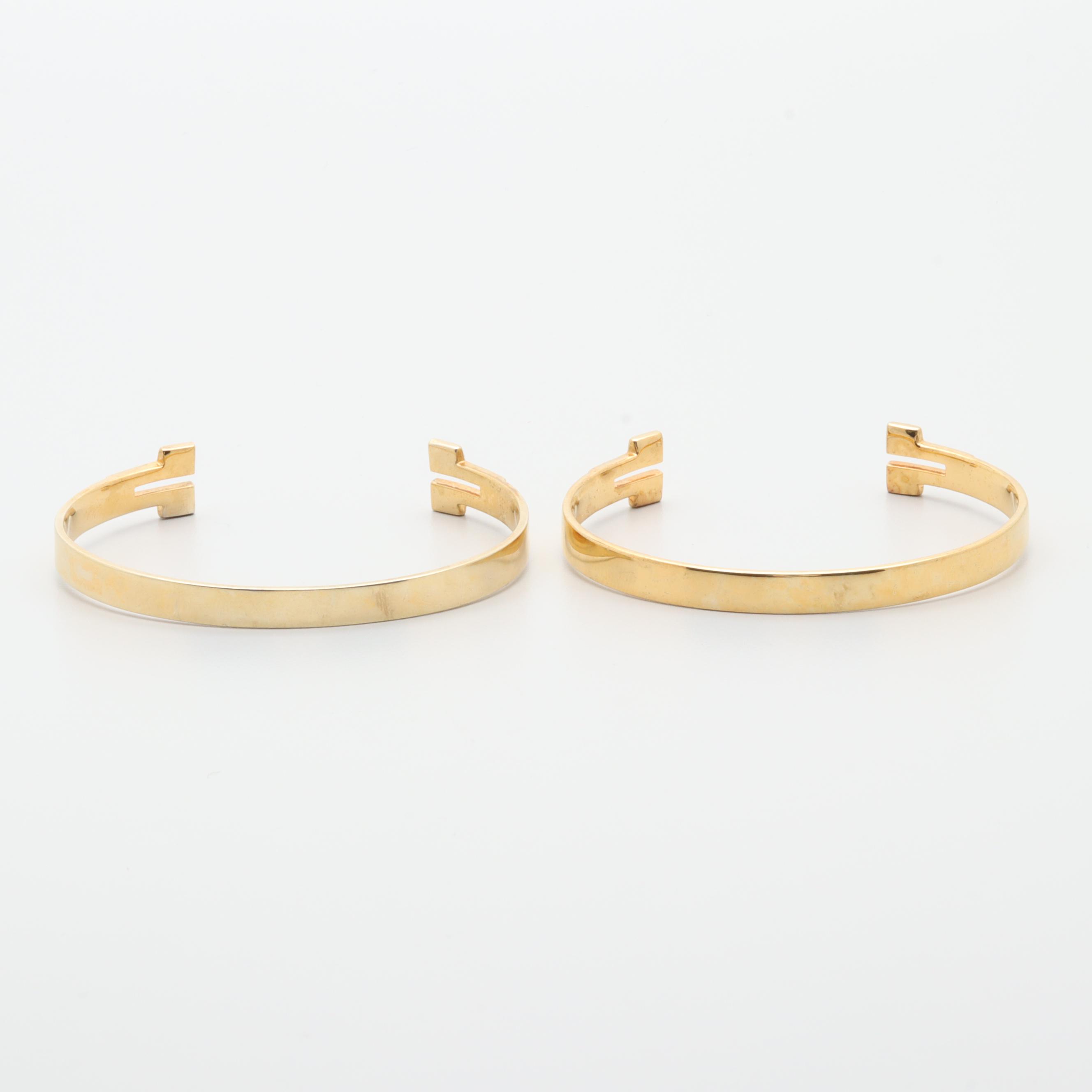 Gold Tone Necklace and Bracelets Featuring Tory Burch and Diane Von Furstenburg