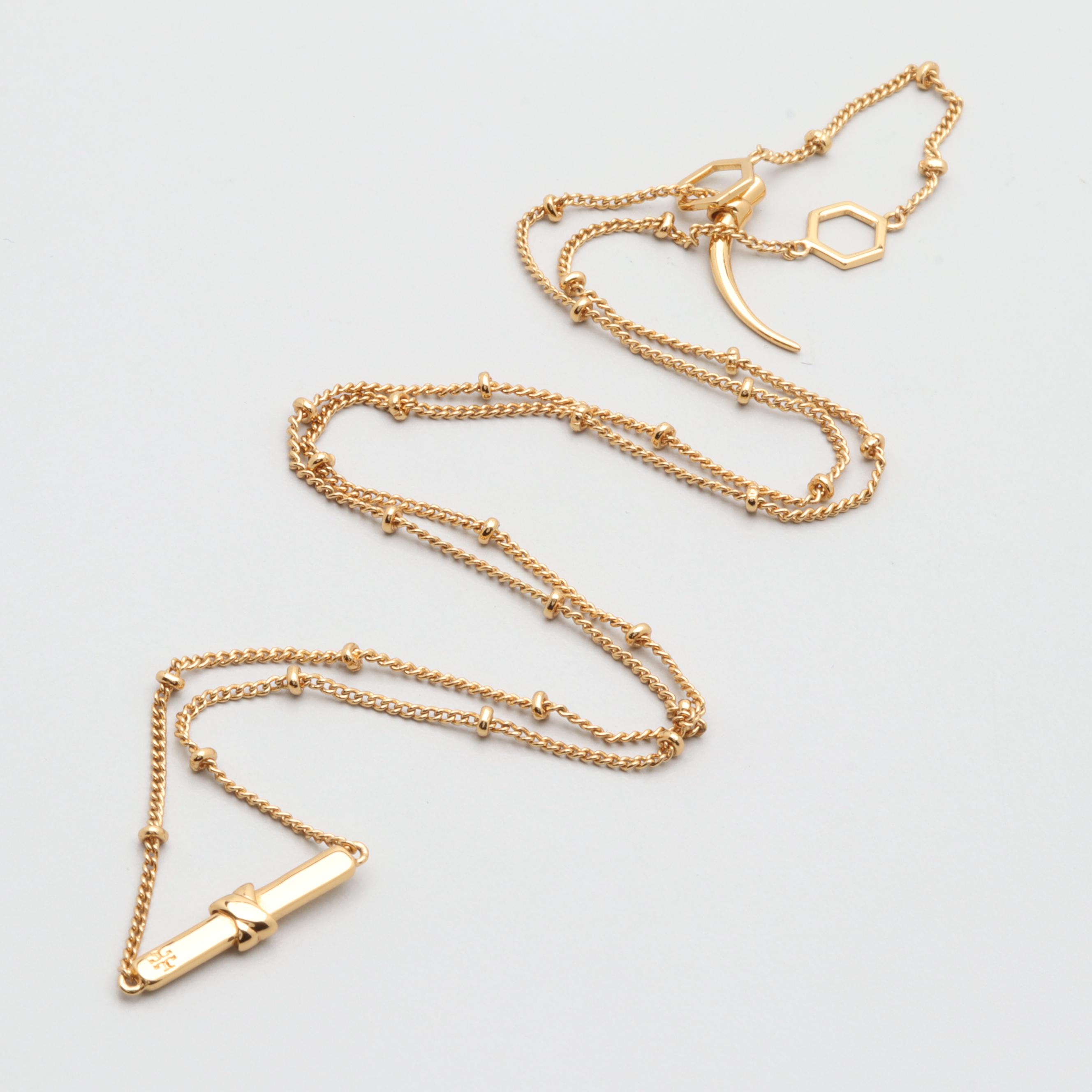 Gold Tone Necklace and Bracelets Featuring Tory Burch and Diane Von Furstenburg
