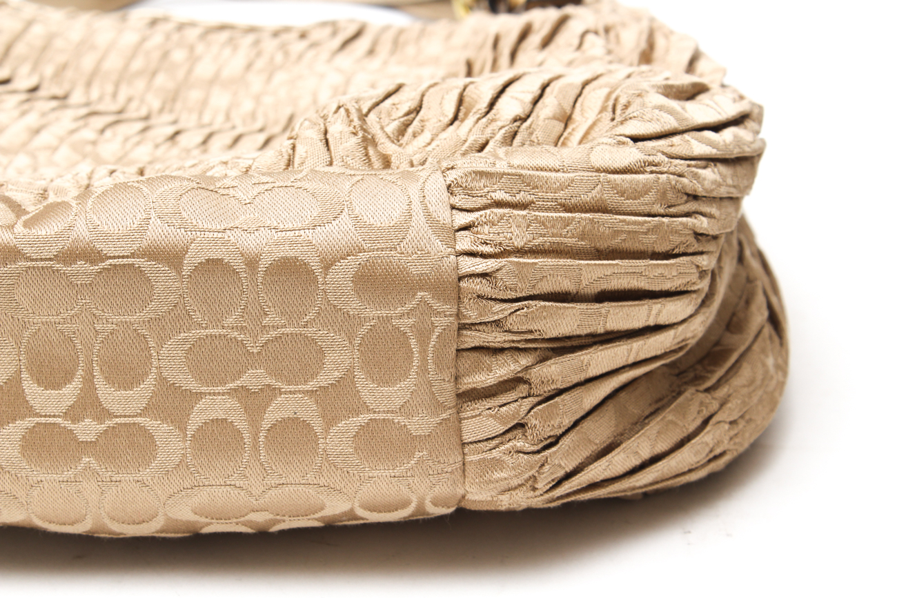 Coach Maggie Madison Signature Shoulder Bag and a Coach Metallic Duffle Bag