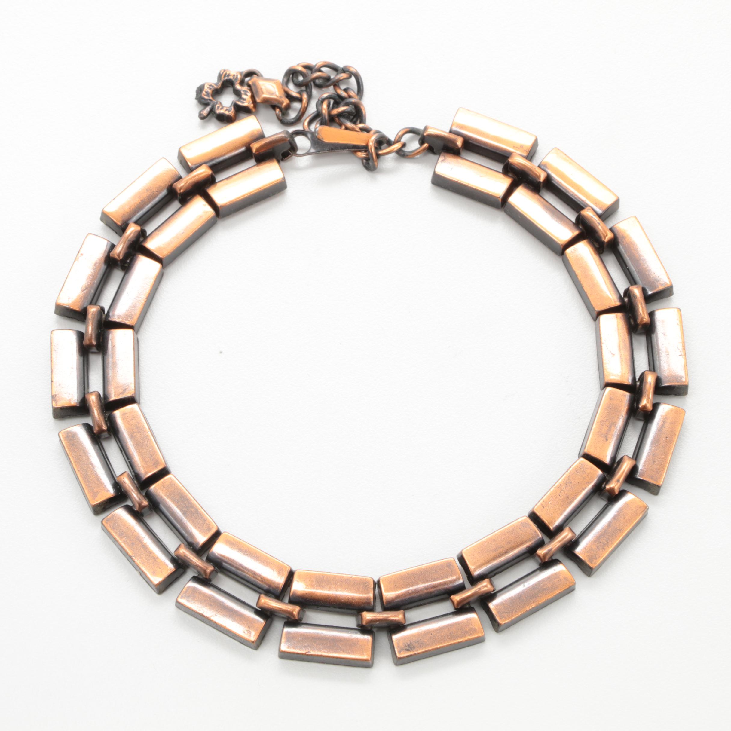 Cooper Jewelry Assortment with a Butterfly Motif Brooch