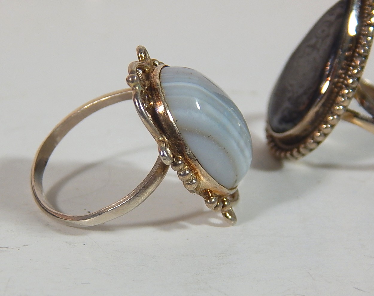 Two Sterling Silver Rings with Grey and White Striated, and Black Sculptured