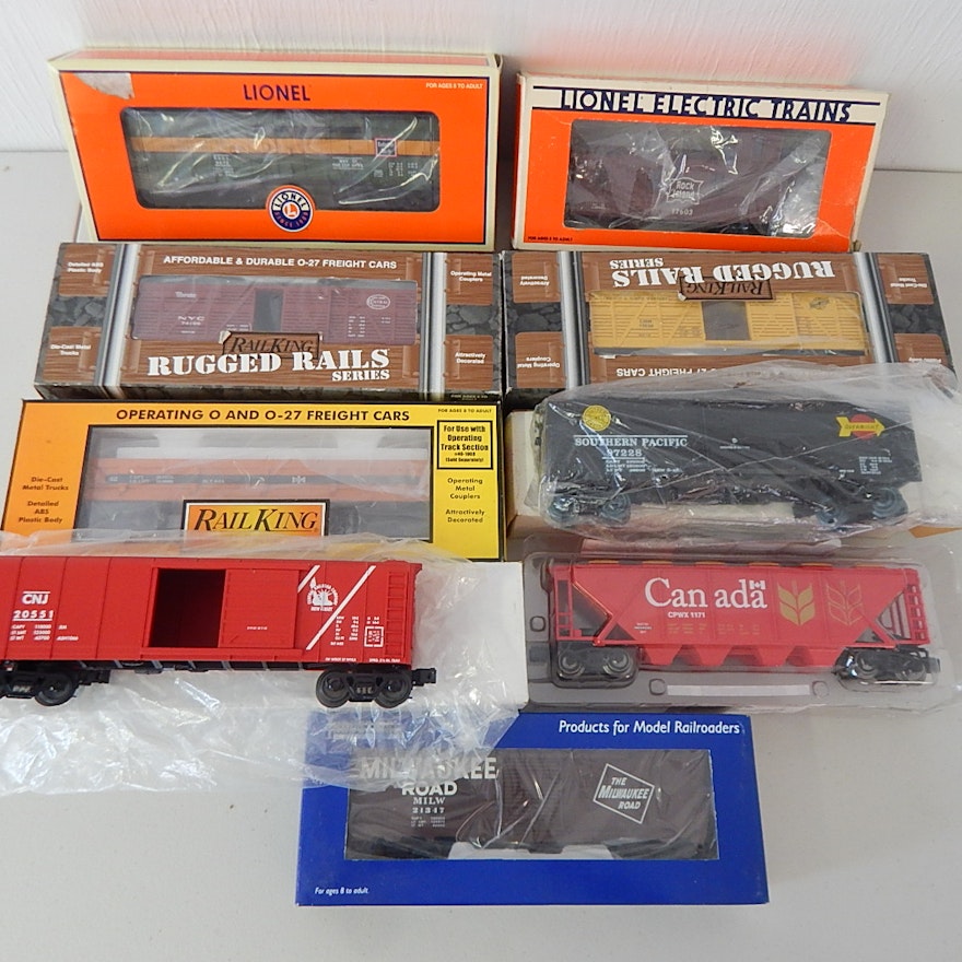 Nine O-Gauge Train Cars with Lionel, Rail King, Industrial