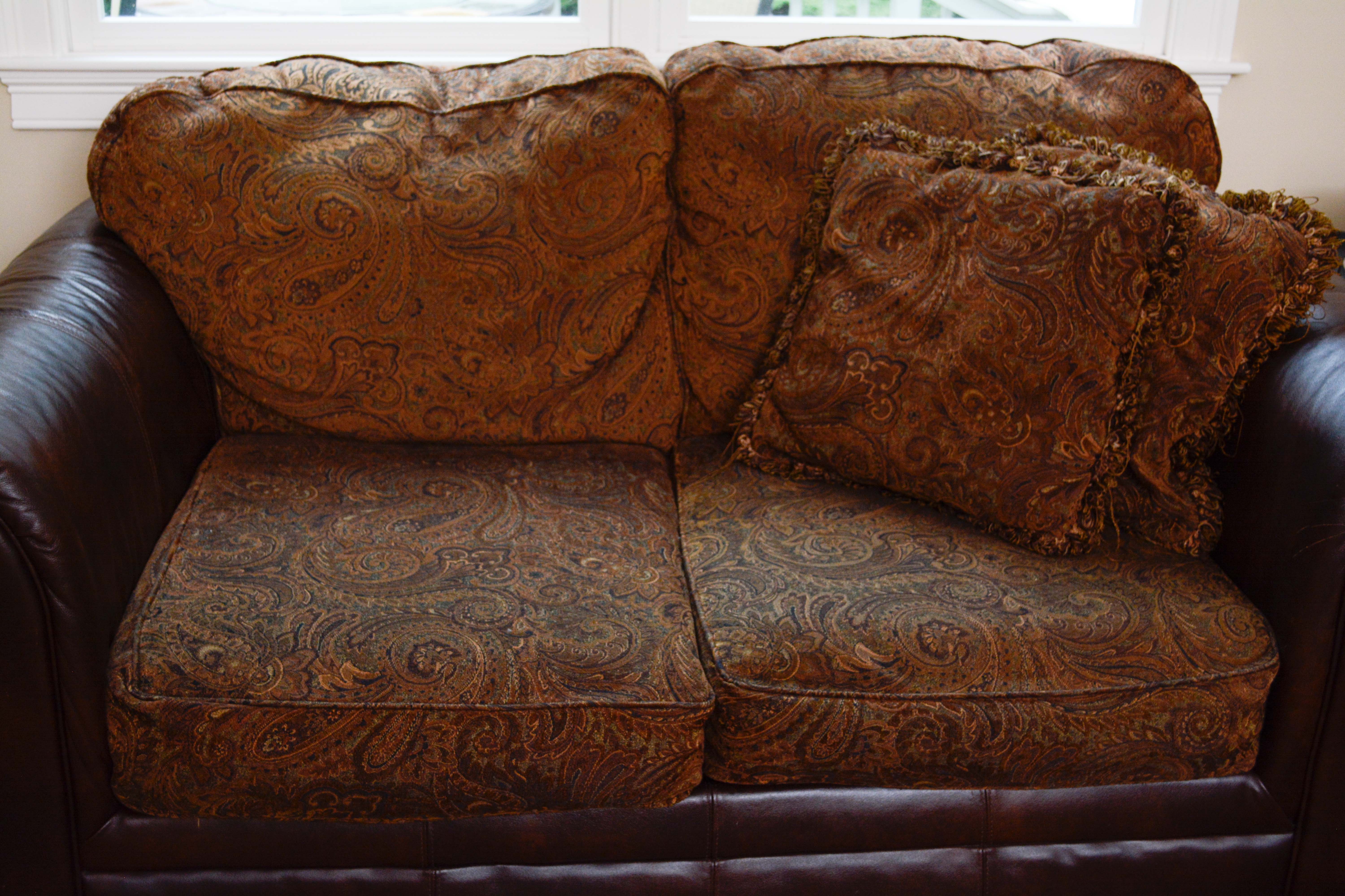 Leather and Paisley Loveseat by Ashley Home Furniture