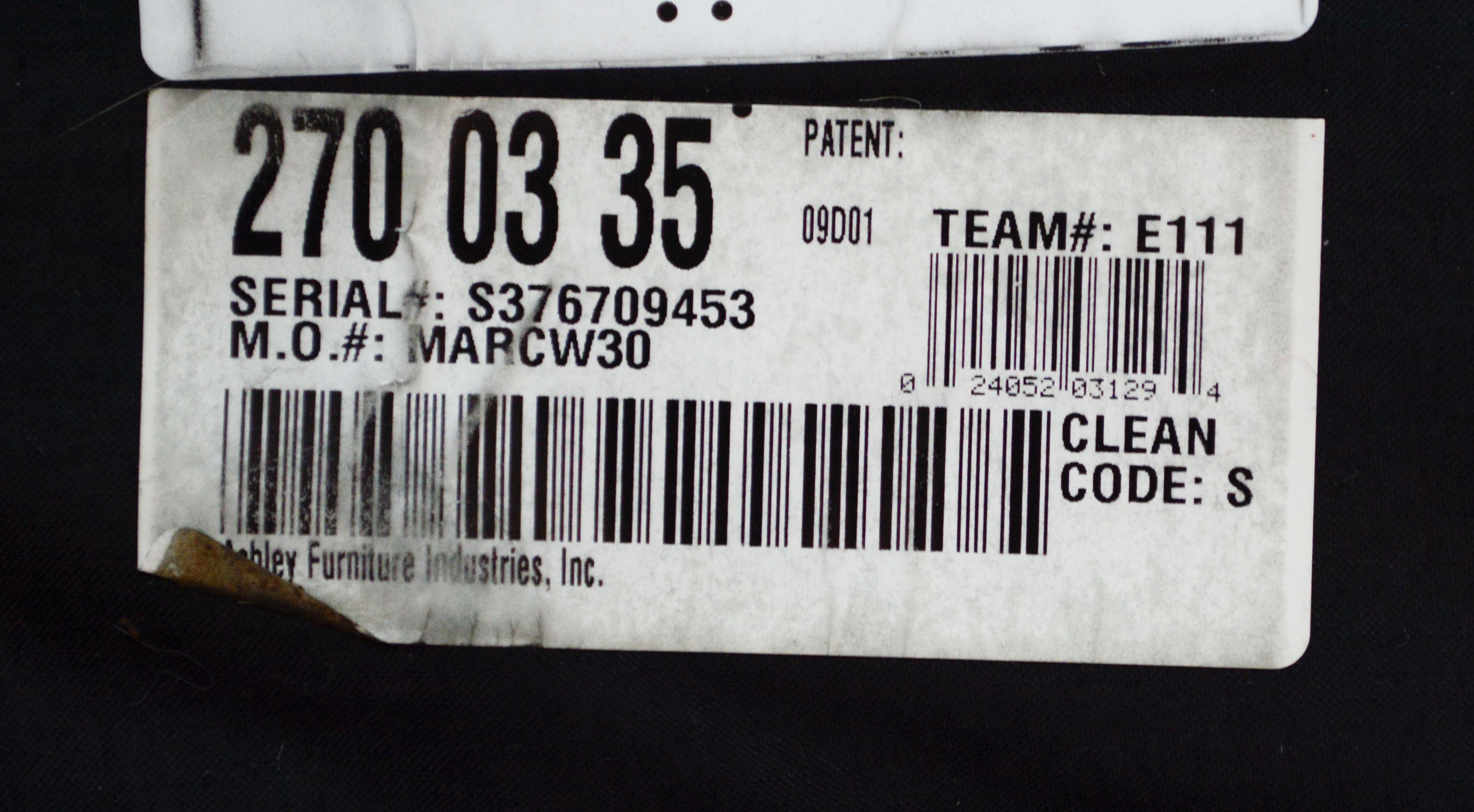 Leather and Paisley Loveseat by Ashley Home Furniture