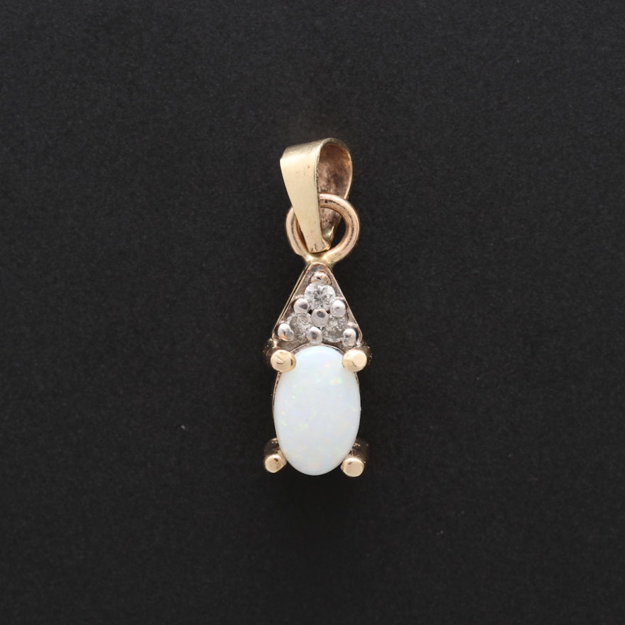 10K Yellow Gold Opal and Diamond Pendant With 14K Yellow Gold Bail