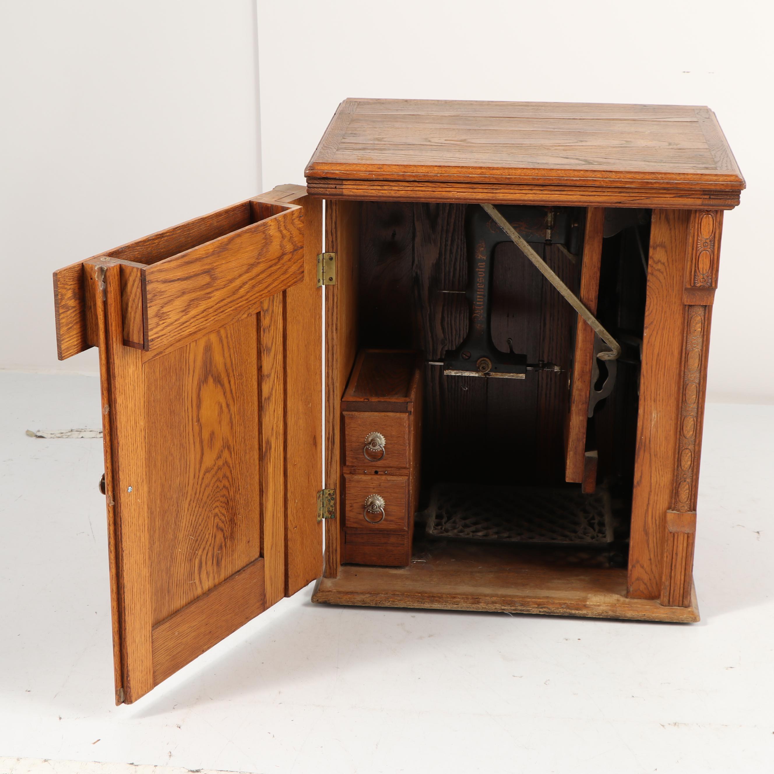 Sears-Roebuck Minnesota Model A Sewing Machine in Eastlake Style Oak Cabinet