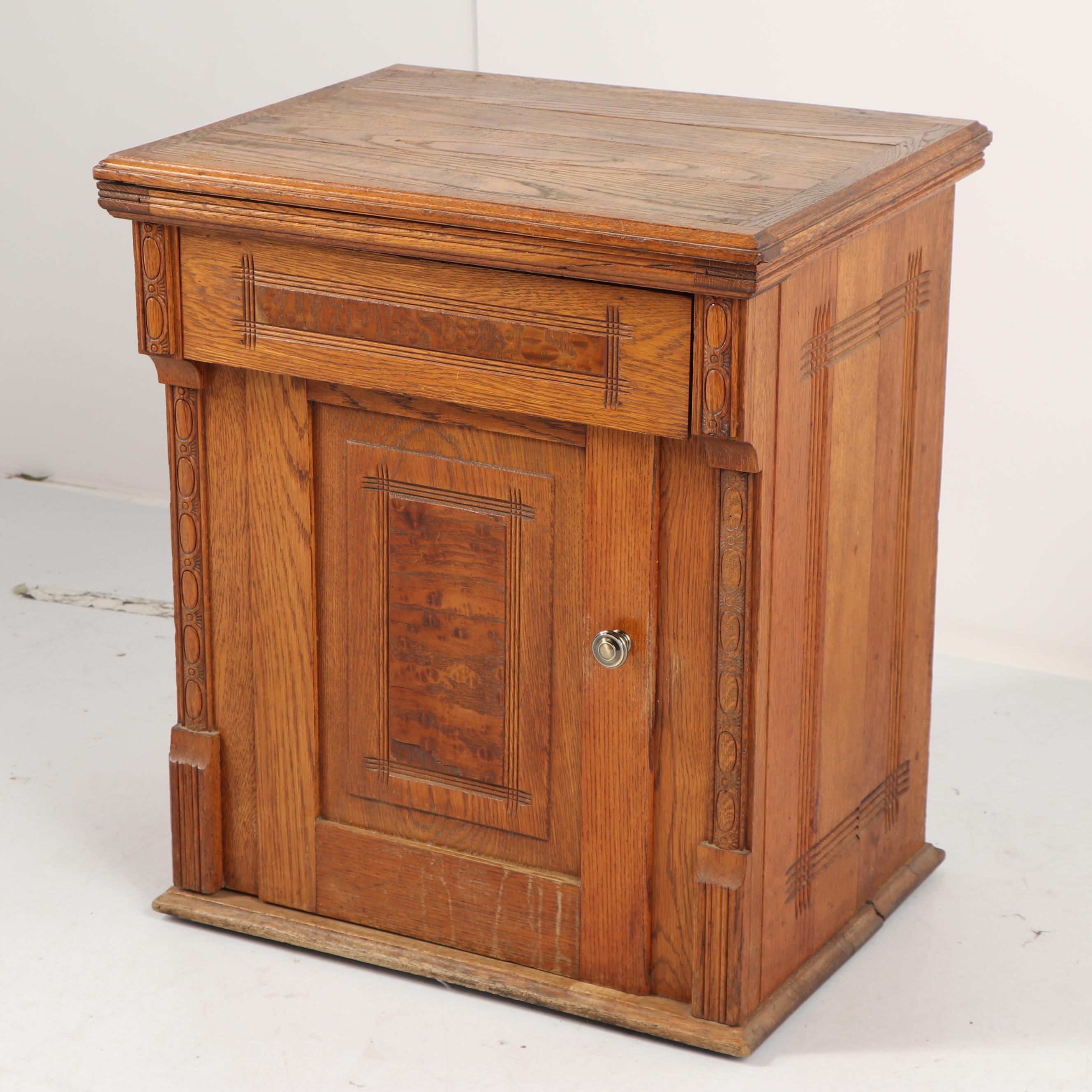 Sears-Roebuck Minnesota Model A Sewing Machine in Eastlake Style Oak Cabinet