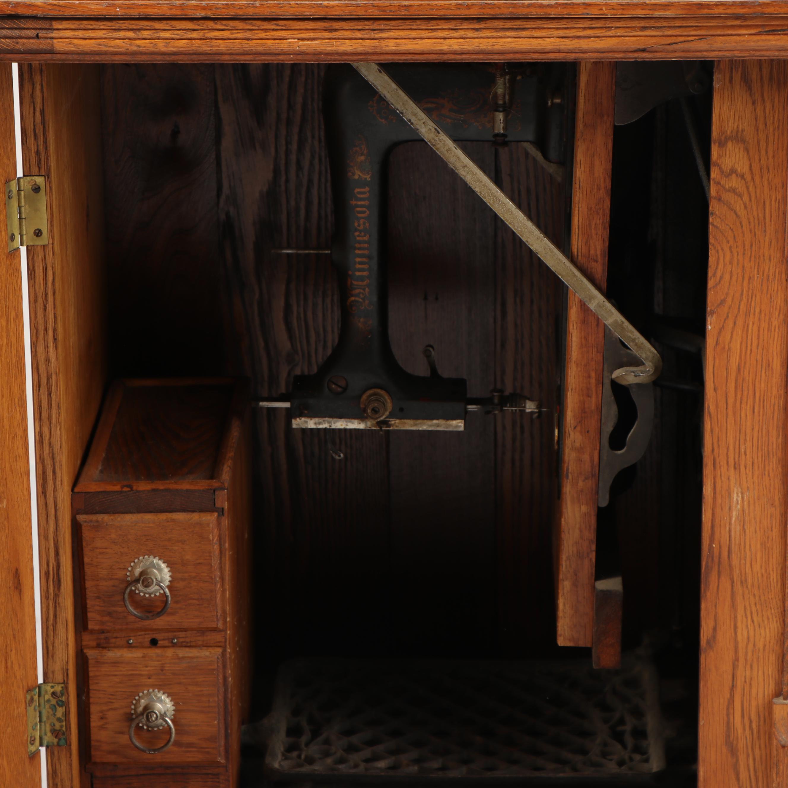 Sears-Roebuck Minnesota Model A Sewing Machine in Eastlake Style Oak Cabinet