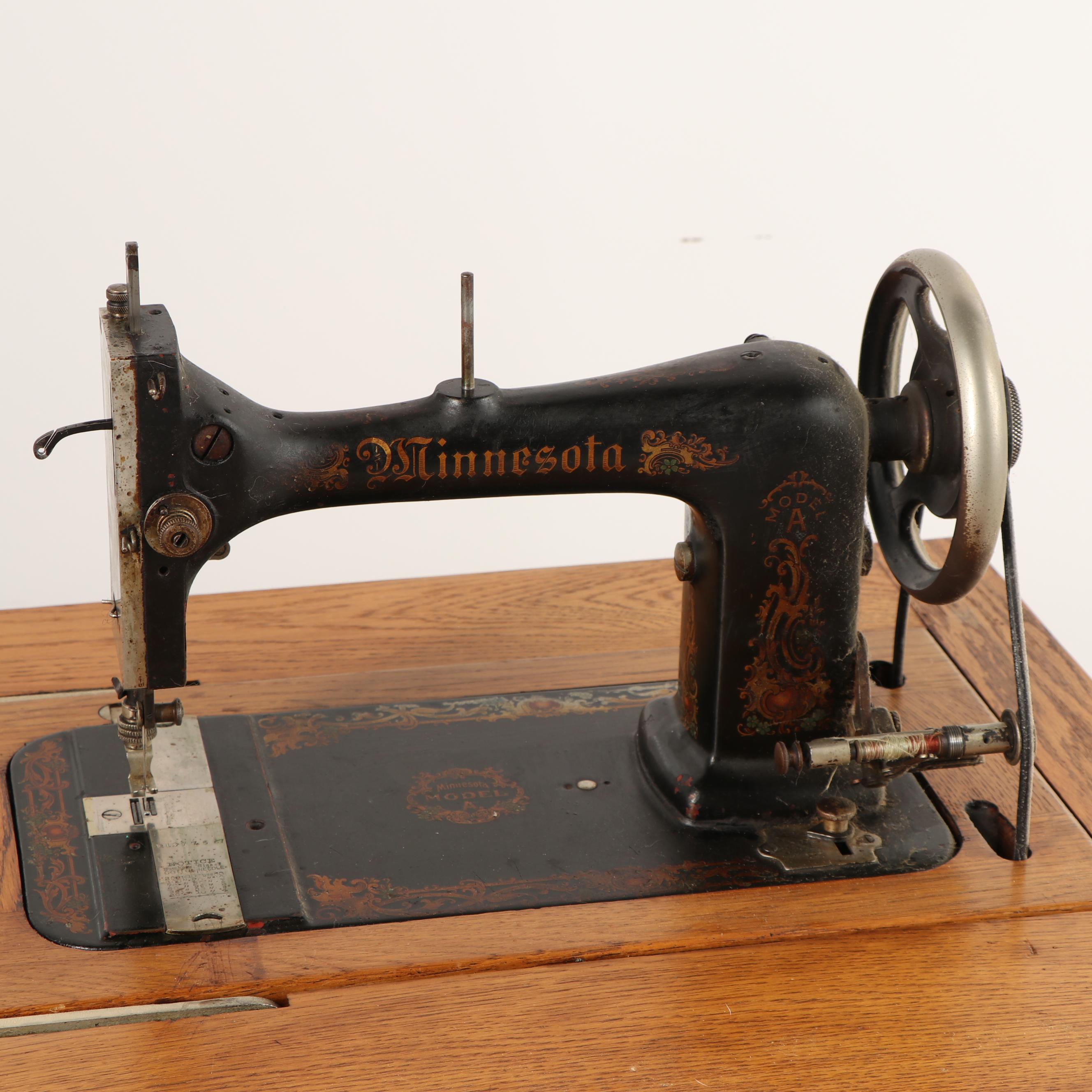 Sears-Roebuck Minnesota Model A Sewing Machine in Eastlake Style Oak Cabinet