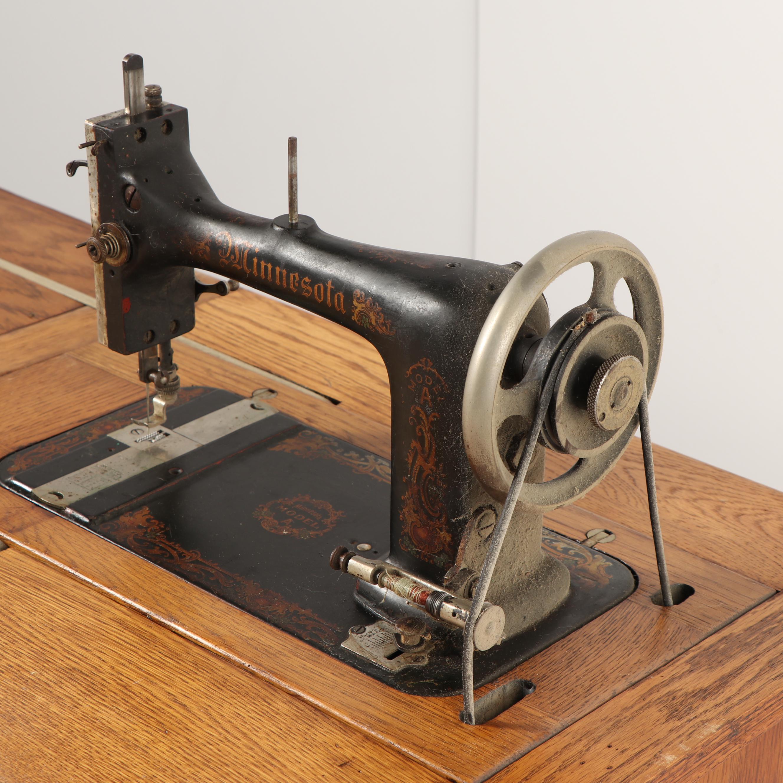 Sears-Roebuck Minnesota Model A Sewing Machine in Eastlake Style Oak Cabinet