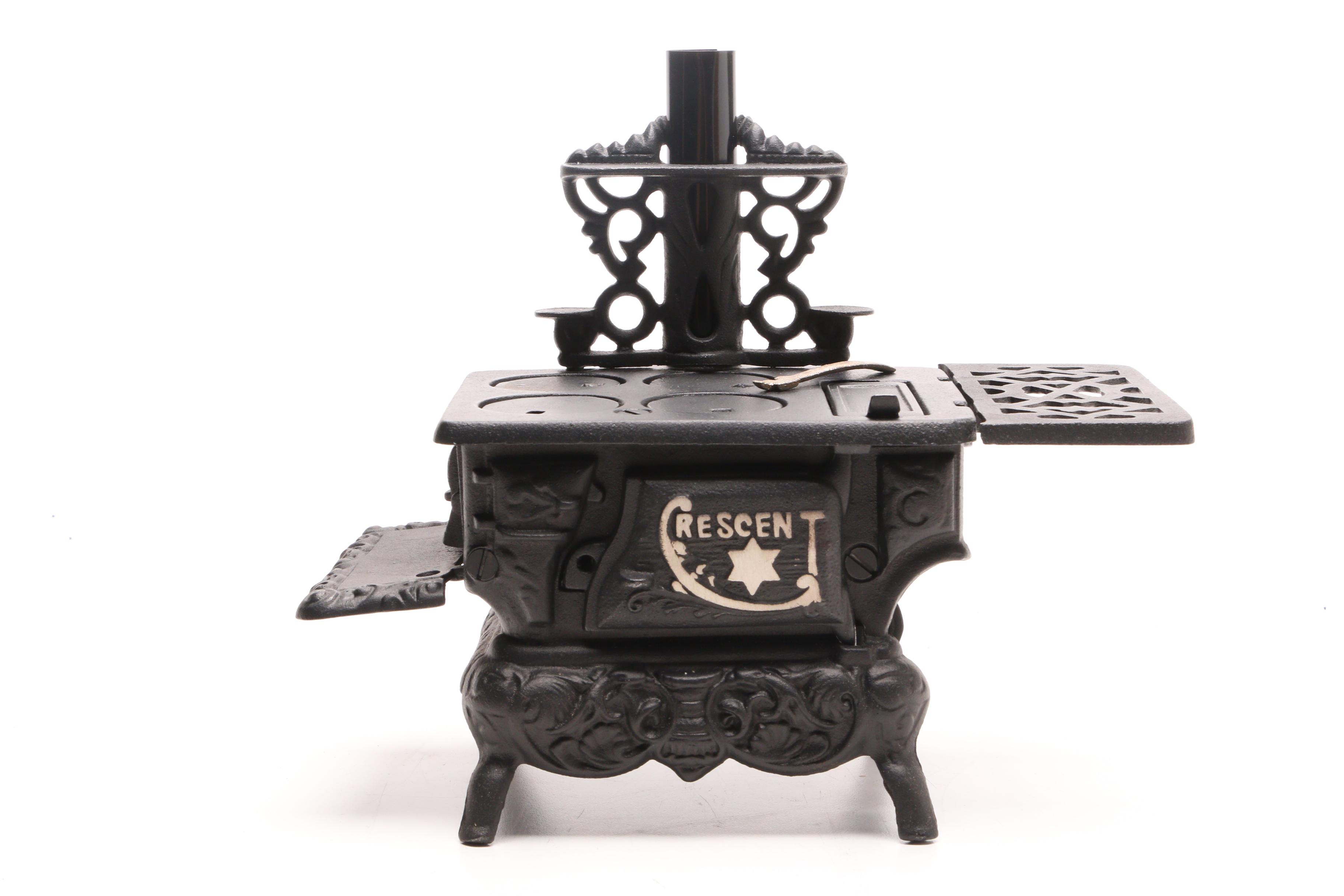 Fisher Price "Tailspin Tabby" Toy with a Greycraft Cast Iron Reproduction Stove