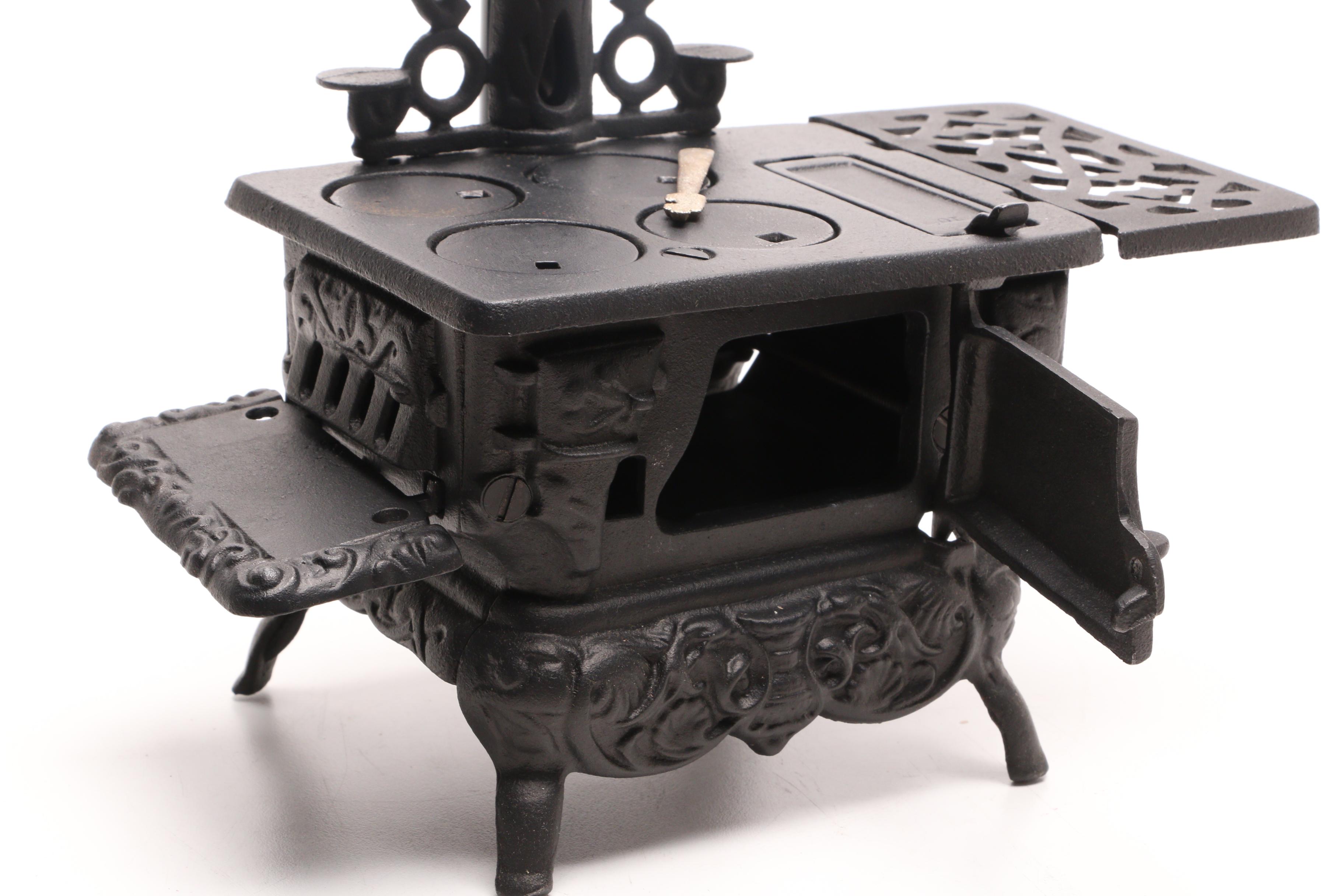 Fisher Price "Tailspin Tabby" Toy with a Greycraft Cast Iron Reproduction Stove