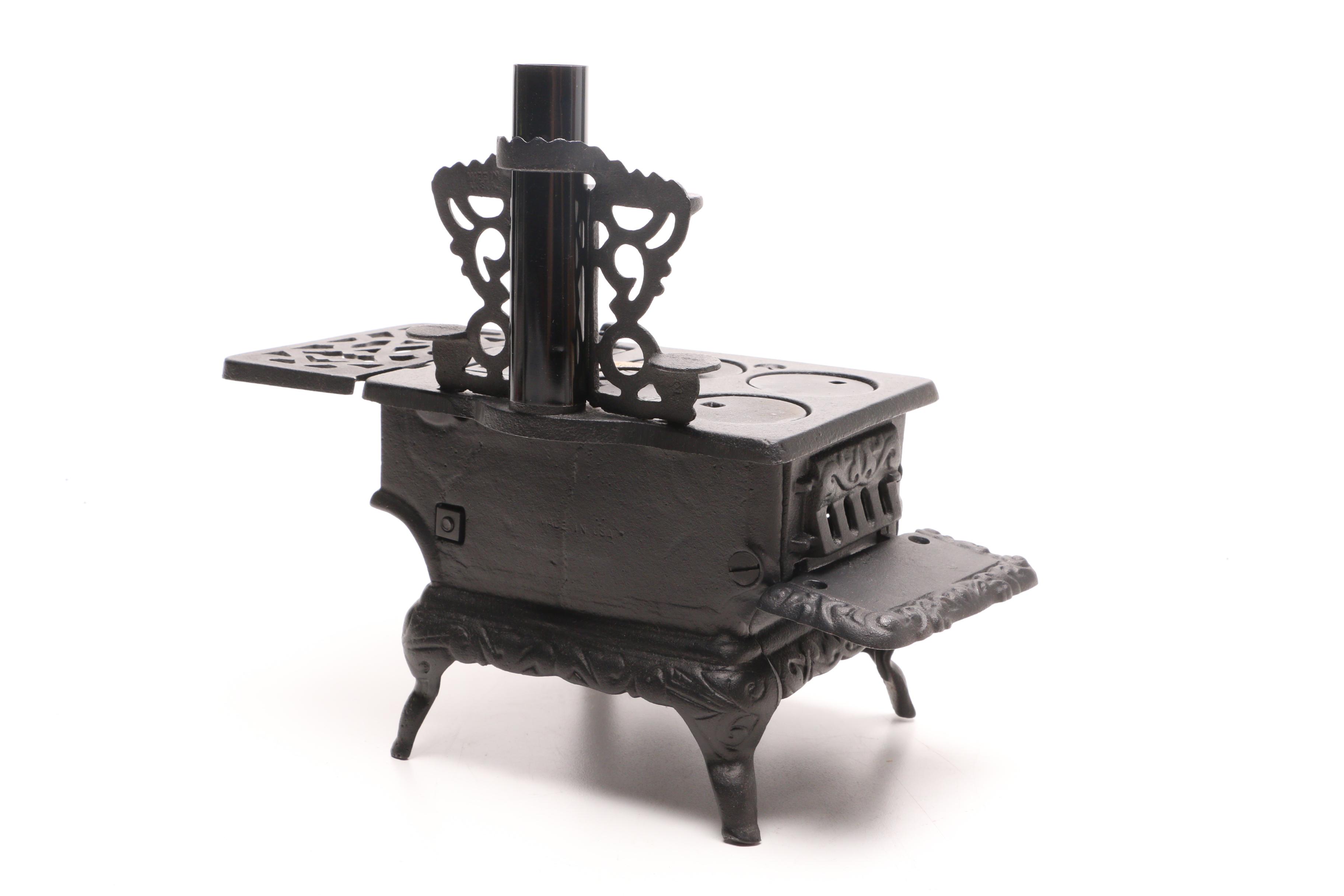 Fisher Price "Tailspin Tabby" Toy with a Greycraft Cast Iron Reproduction Stove