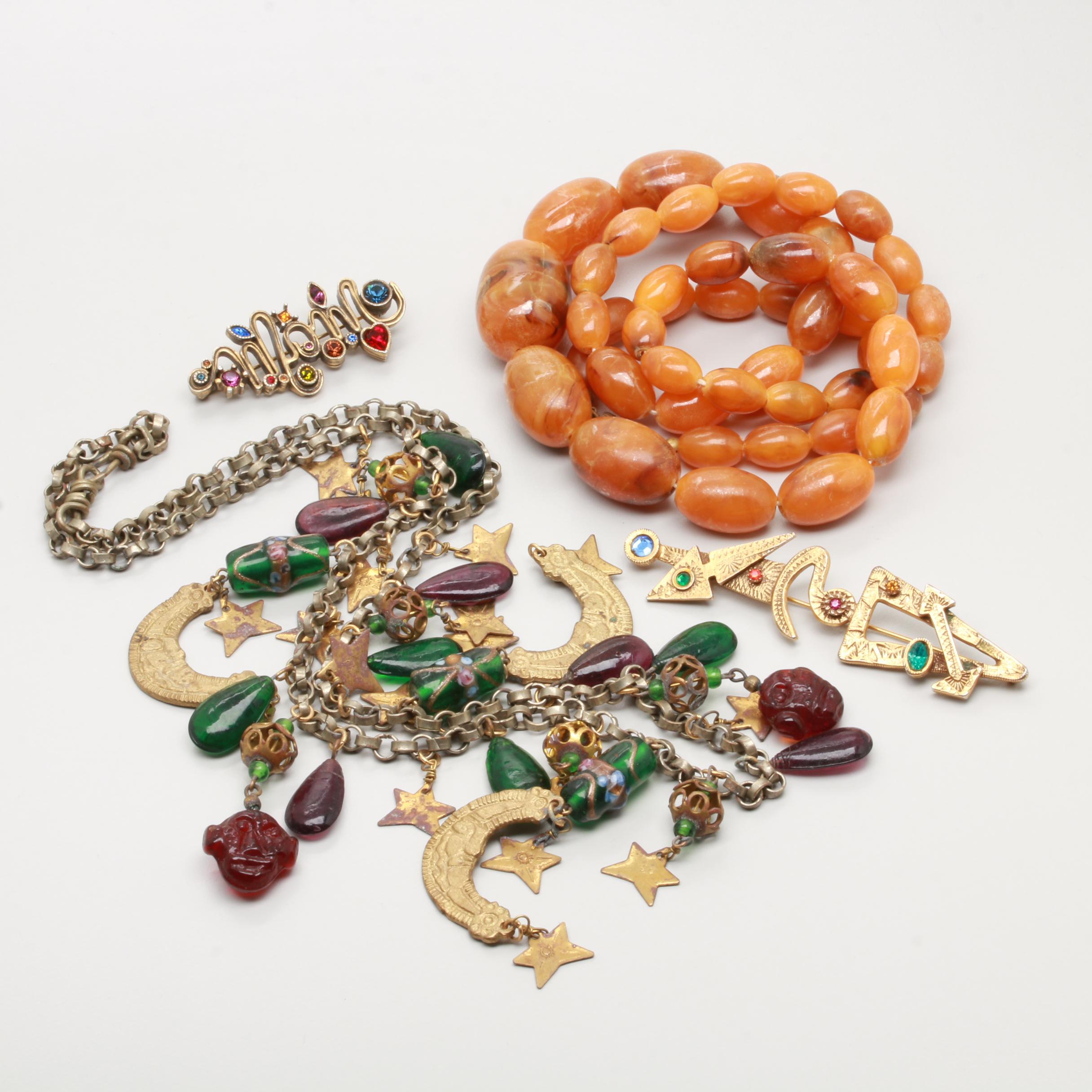 Necklace and Brooch Selection Featuring Copal Resin and Glass