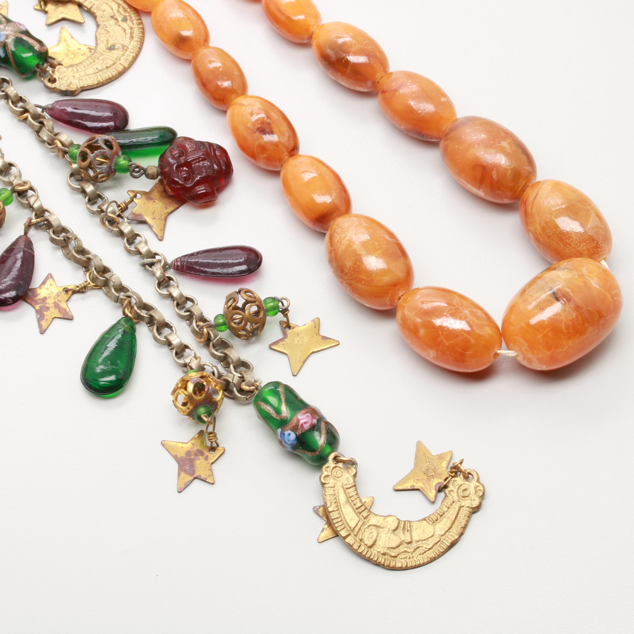 Necklace and Brooch Selection Featuring Copal Resin and Glass