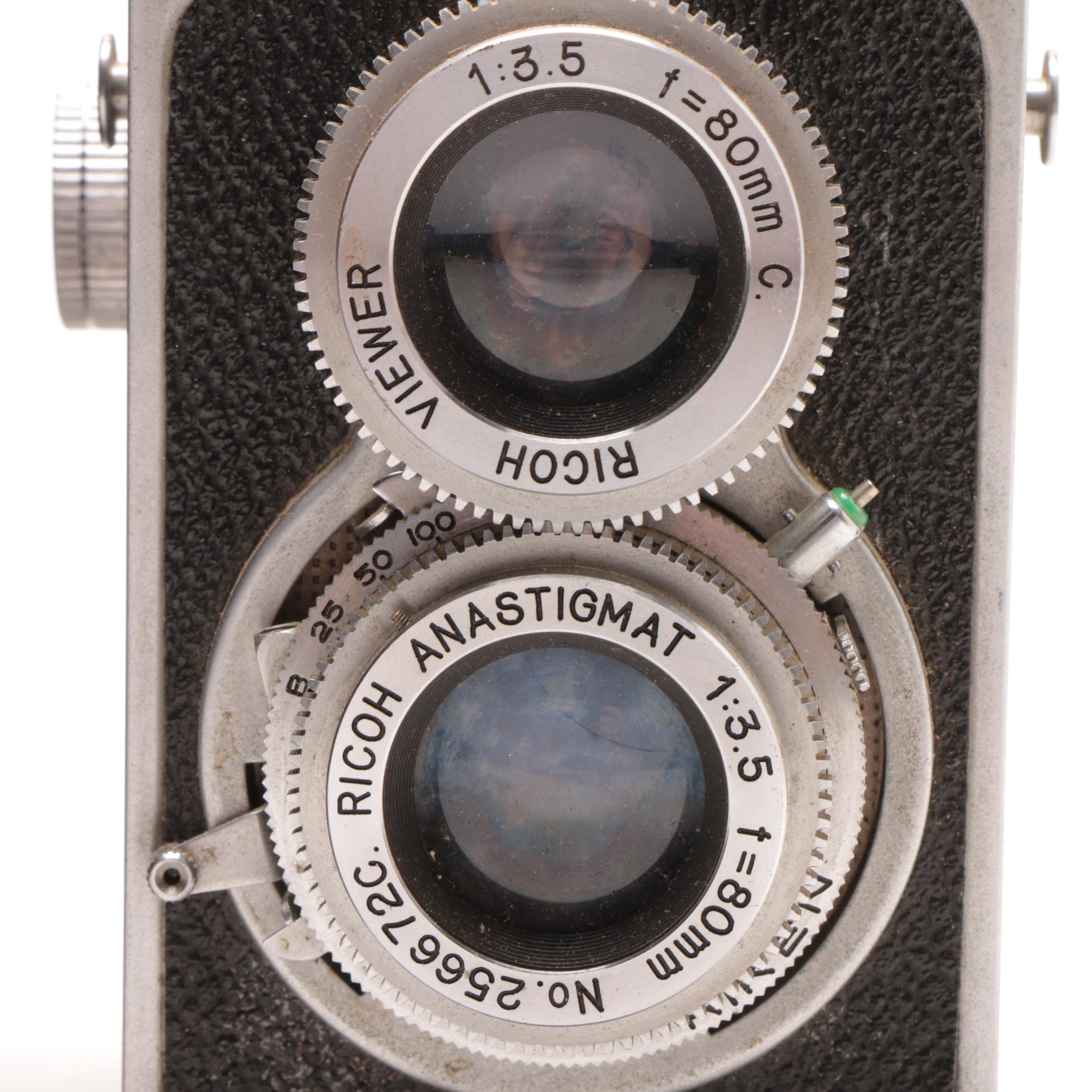 RicohFlex Model VI Camera and Leather Carrier and a Welta Folding Camera