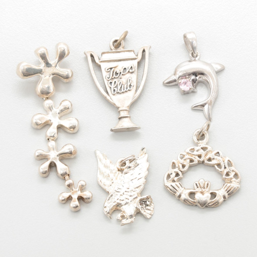 Sterling Silver Charm Assortment Featuring a Dolphin, Eagle, Trophy and Claddagh