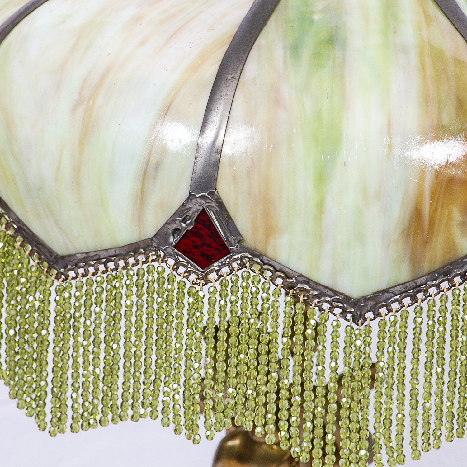 Gold Finish Figural Putti Lamp with Green Slag Glass Paneled Shade with Fringe