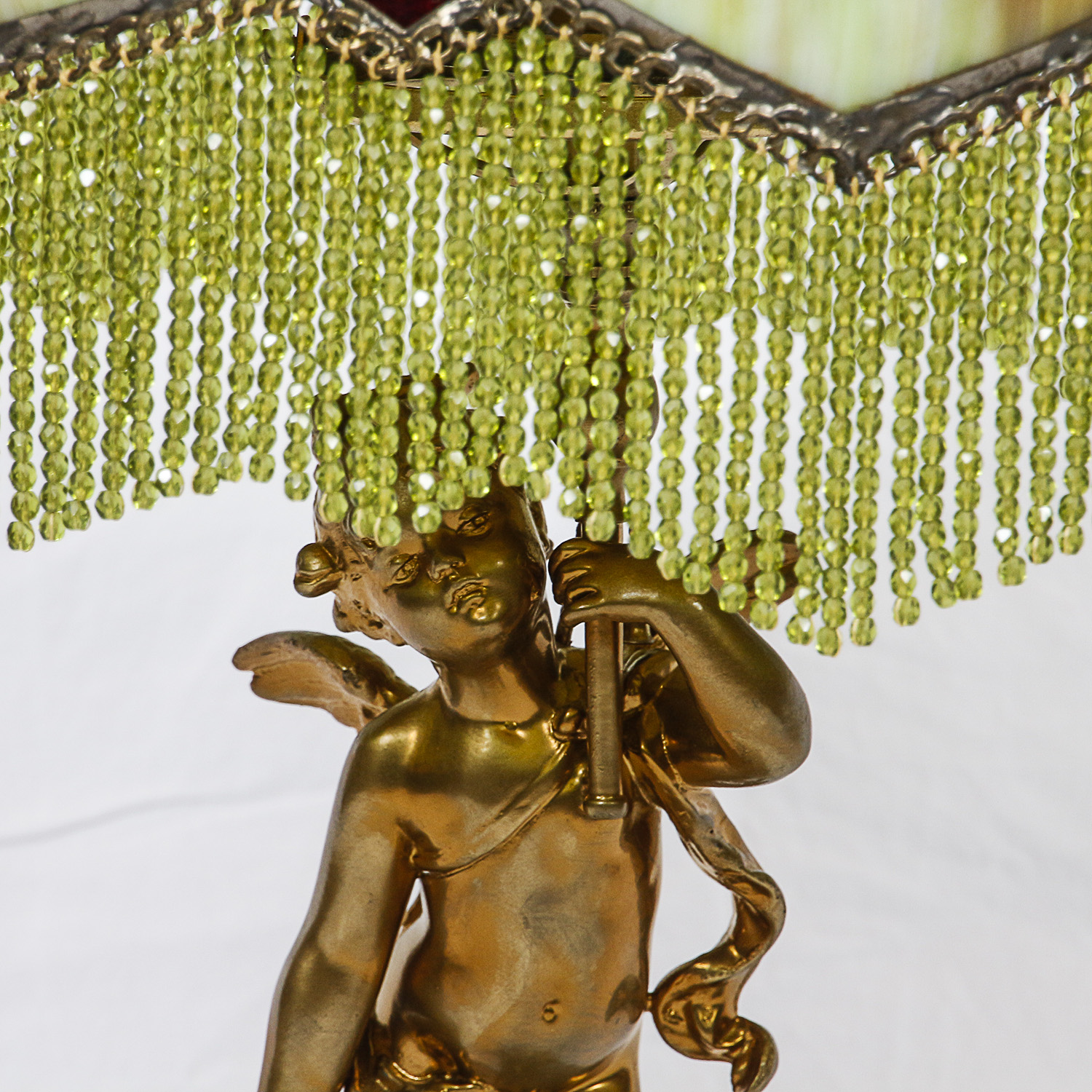 Gold Finish Figural Putti Lamp with Green Slag Glass Paneled Shade with Fringe