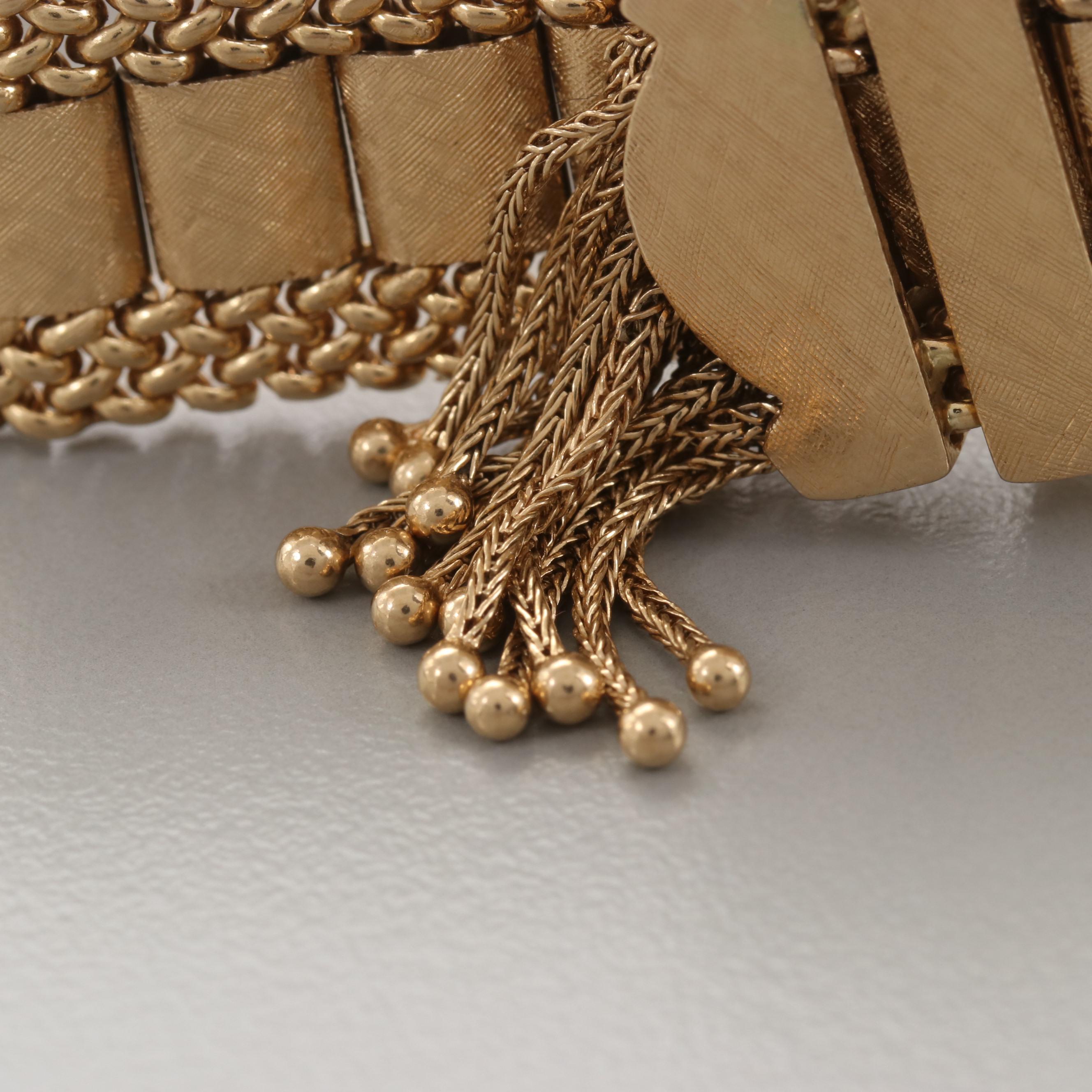 Circa 1940's Taylor & Co. 14K Yellow Gold Articulated Slide Bracelet