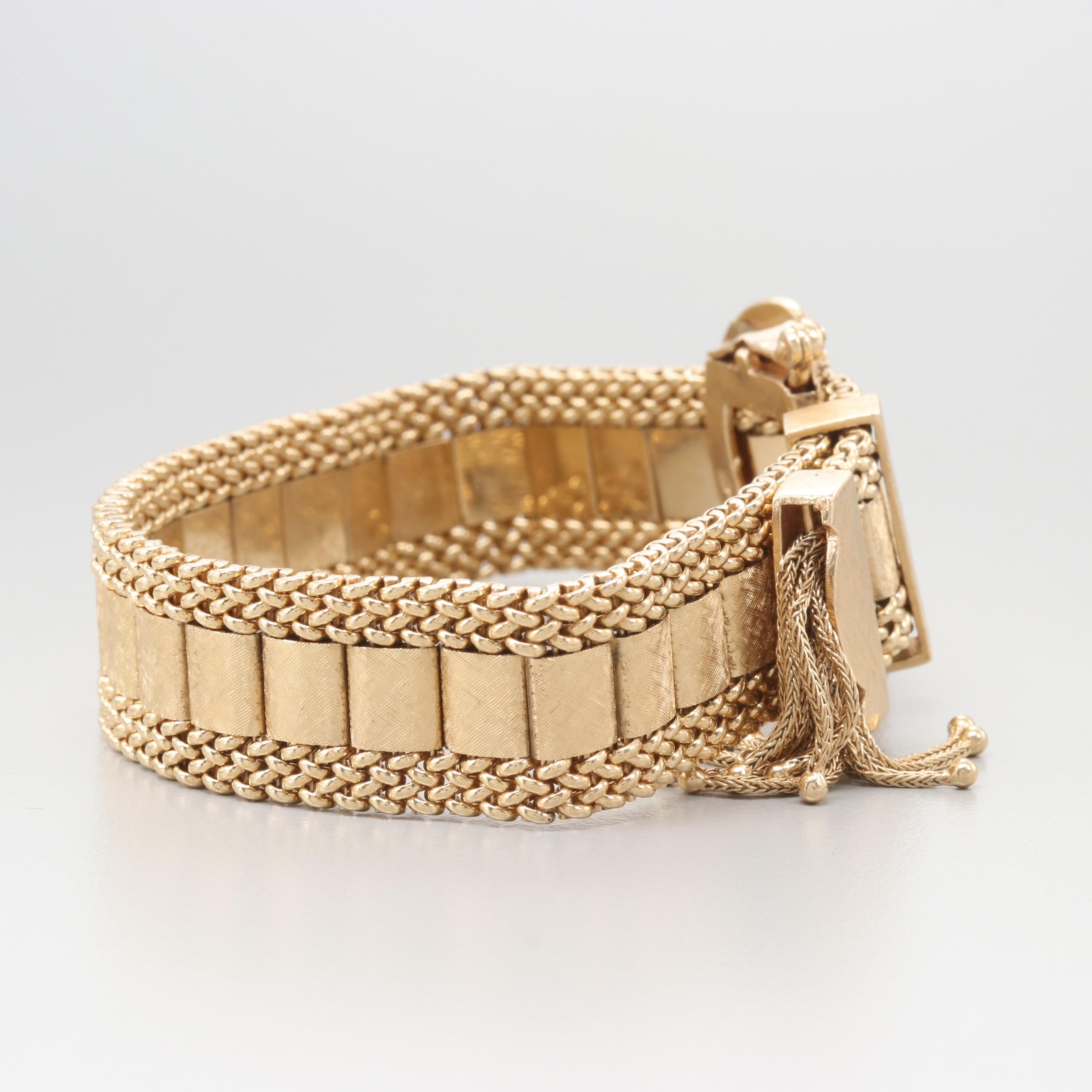 Circa 1940's Taylor & Co. 14K Yellow Gold Articulated Slide Bracelet