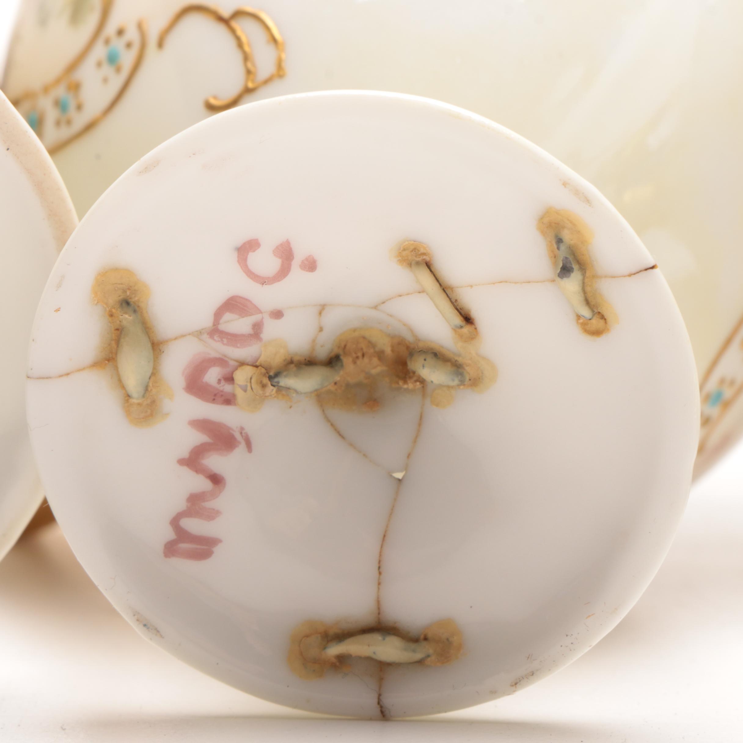 French Limoges and Arnart Demitasse Cups in Ornamental Cup Holders