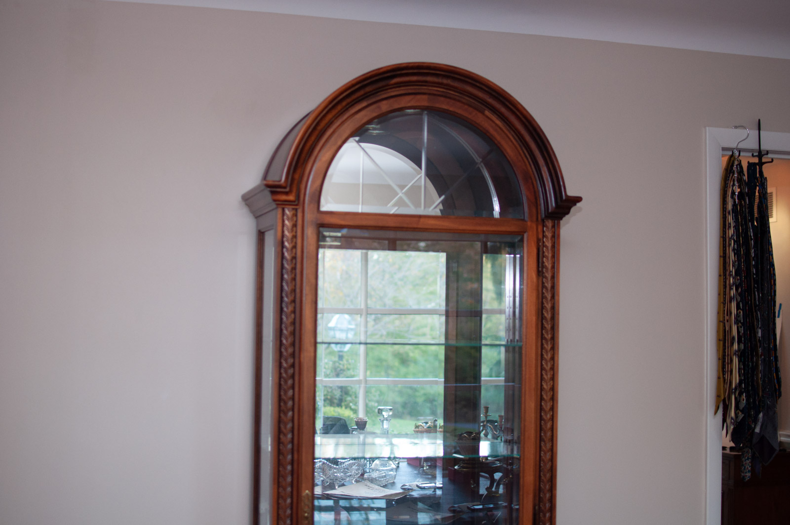 Neoclassical Style Walnut Finish "Armand" Curio Cabinet by Howard Miller