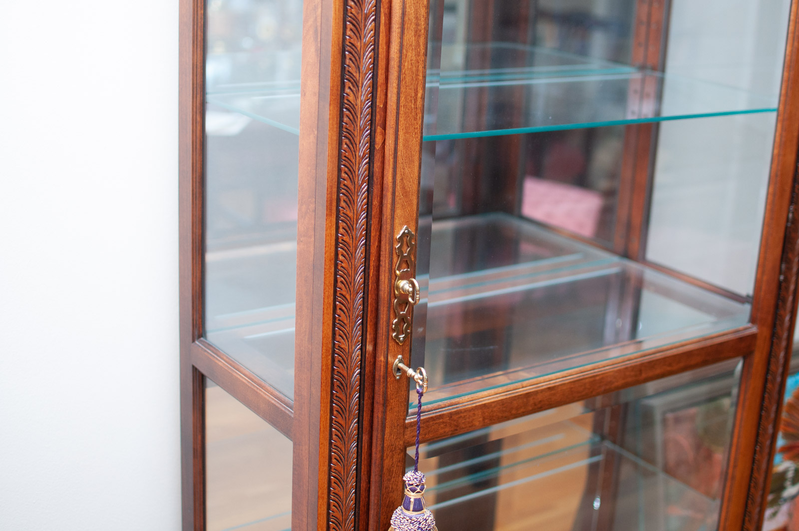 Neoclassical Style Walnut Finish "Armand" Curio Cabinet by Howard Miller