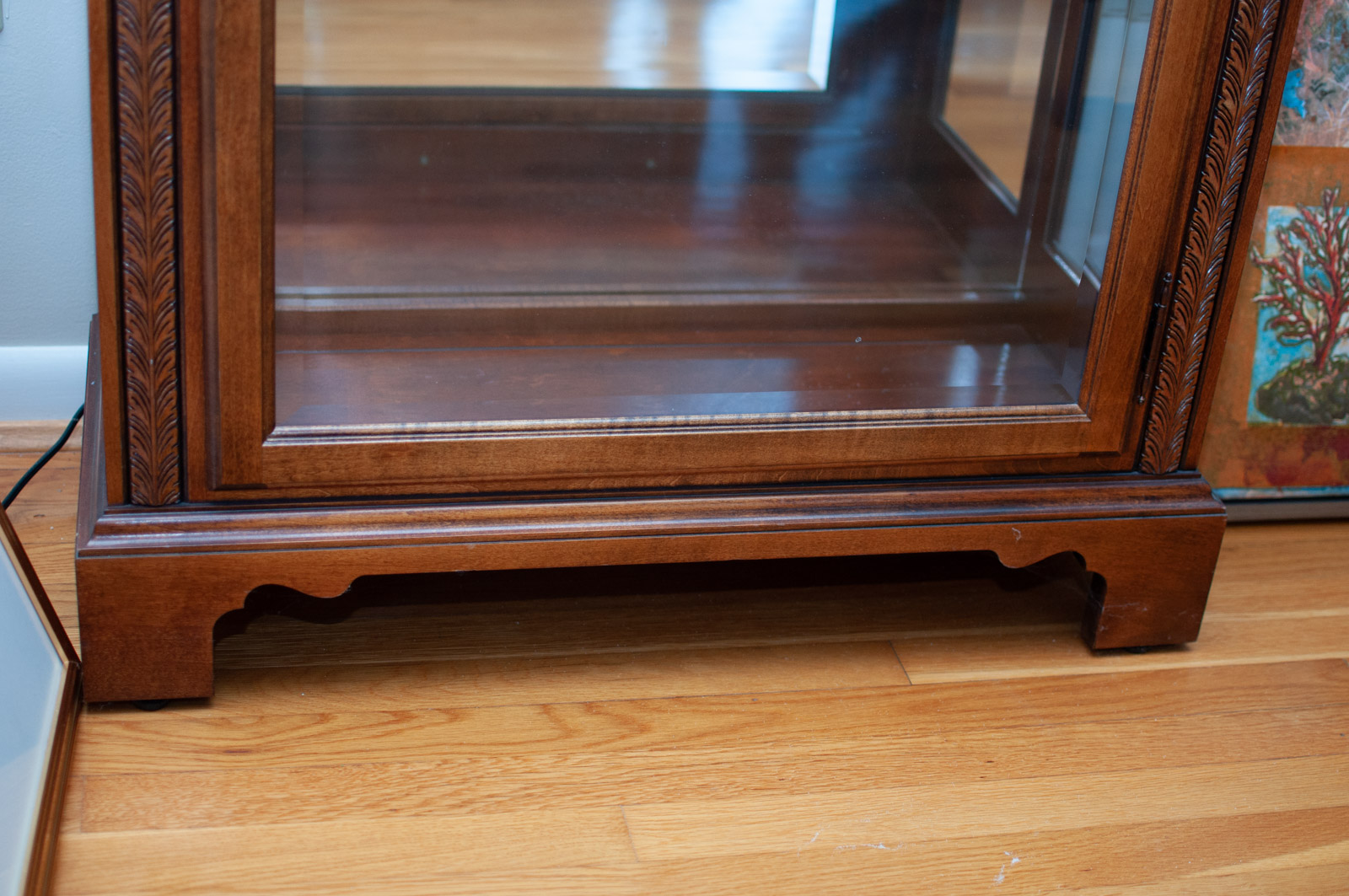 Neoclassical Style Walnut Finish "Armand" Curio Cabinet by Howard Miller