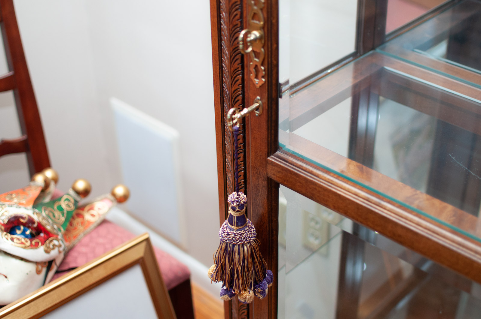 Neoclassical Style Walnut Finish "Armand" Curio Cabinet by Howard Miller