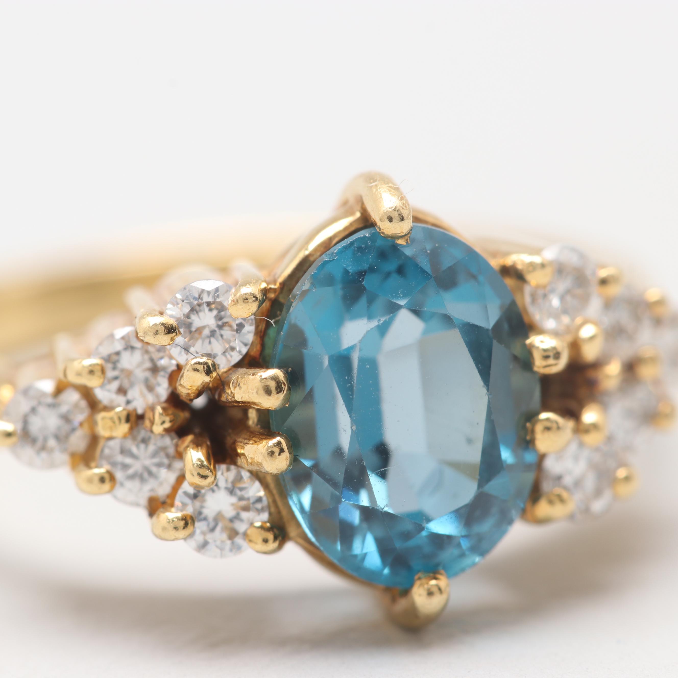 Circa 1960s 18K Yellow Gold Blue Topaz and Diamond Ring