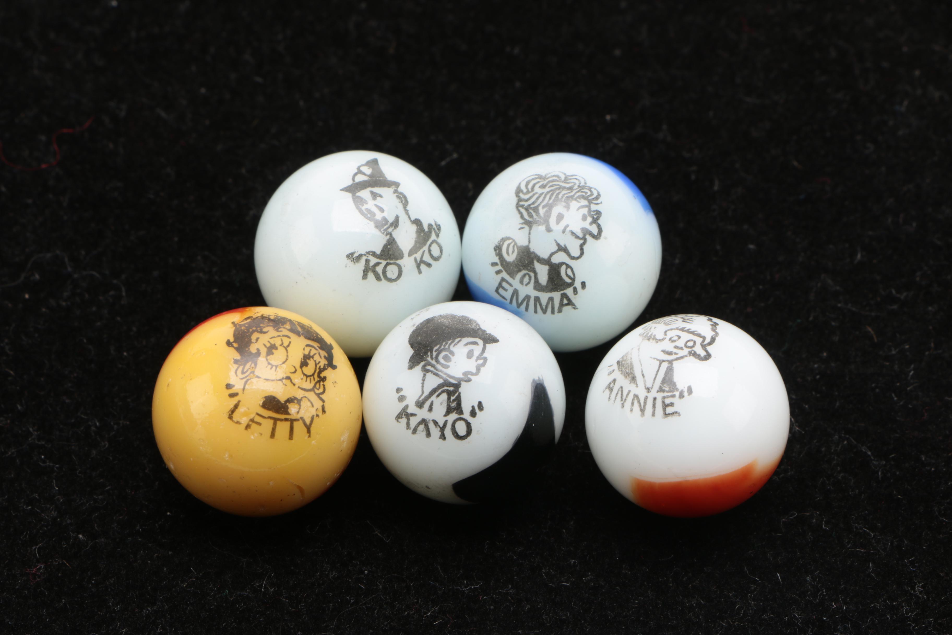 Vintage Glass Comic Marbles Including "Kayo" and "Annie" by The Peltier Glass Co