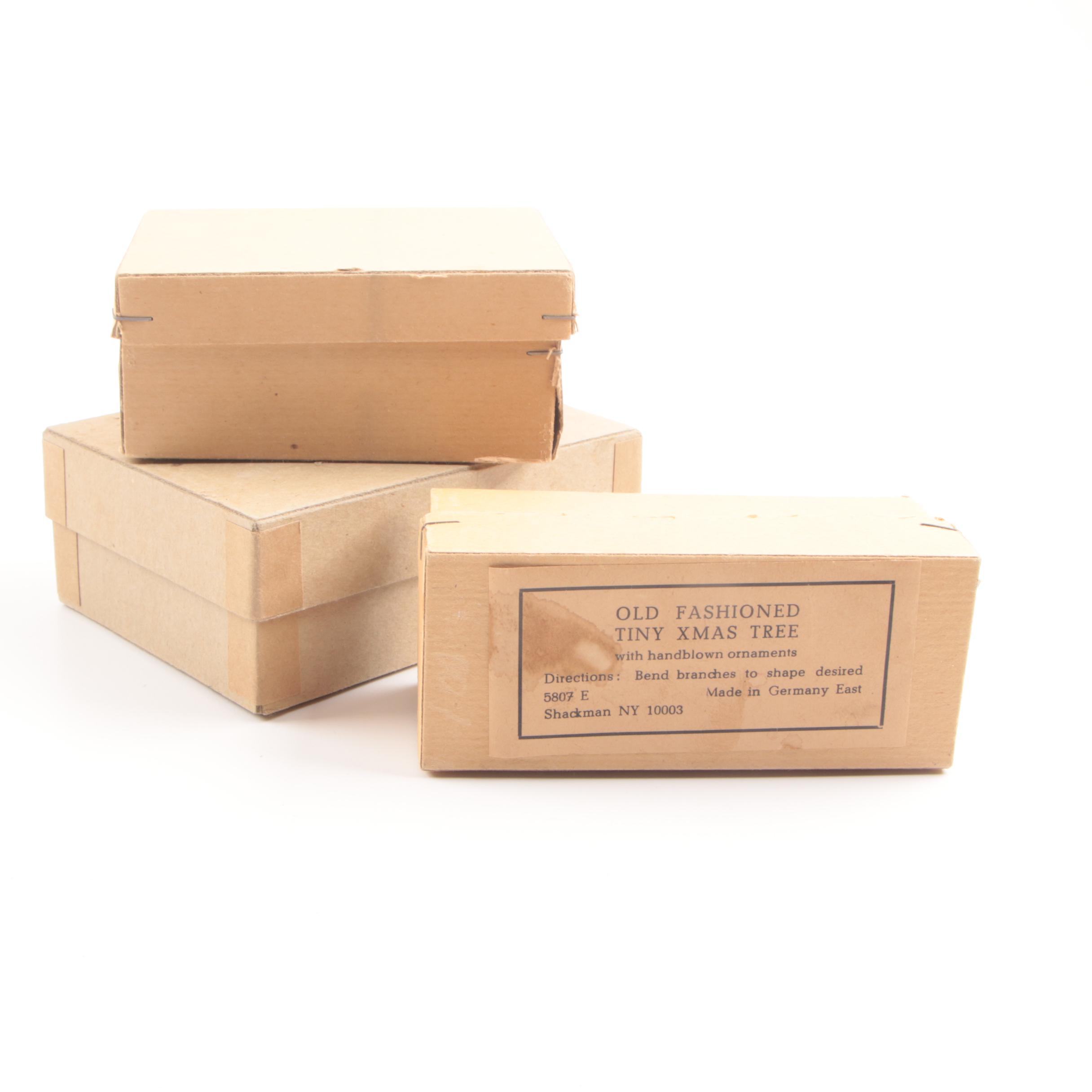 Collection of Seven Vintage Miniature Flocked Bottle Brush Christmas Trees