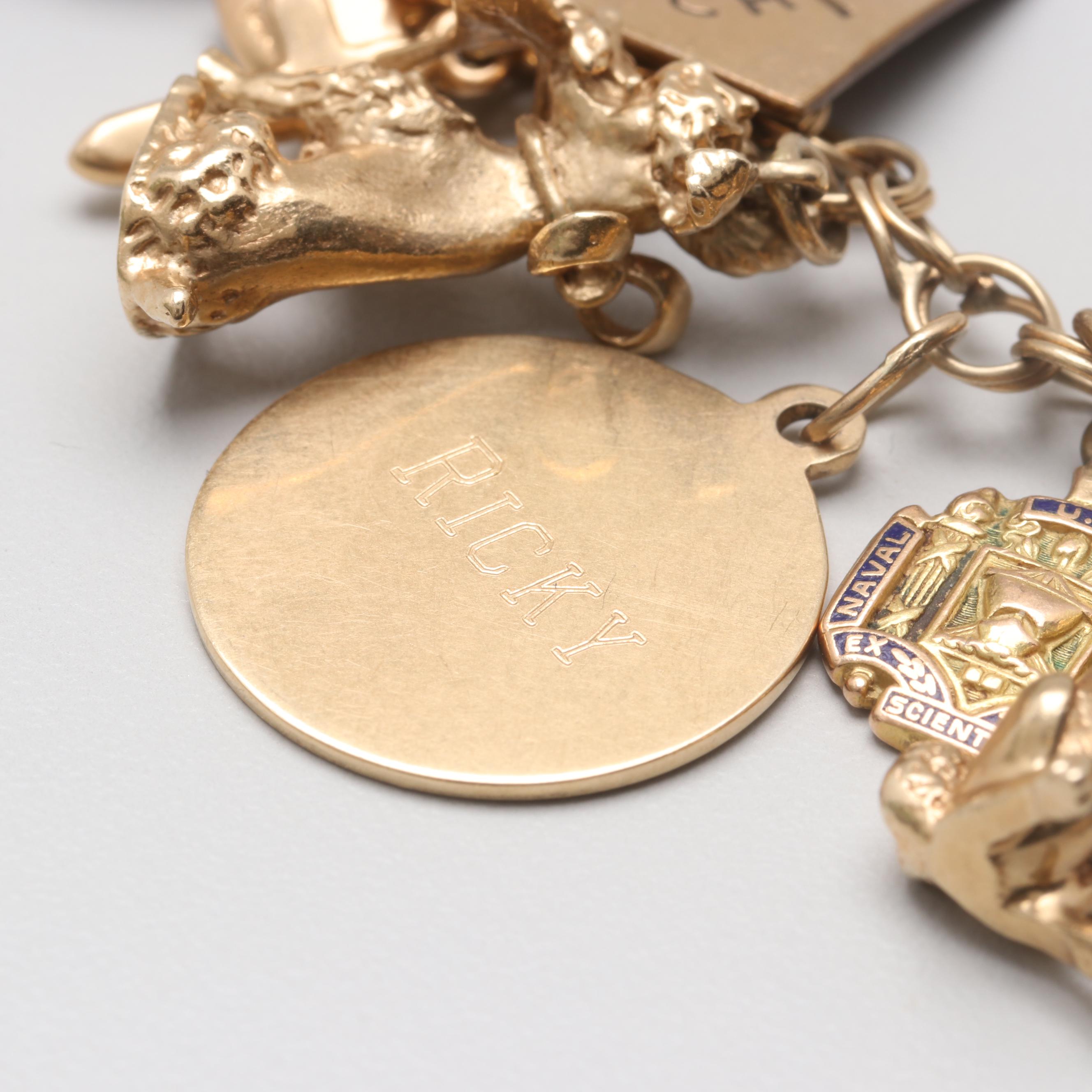 14K Yellow Gold Charm Bracelet with 14K, 10K Yellow Gold and Gold Tone Charms