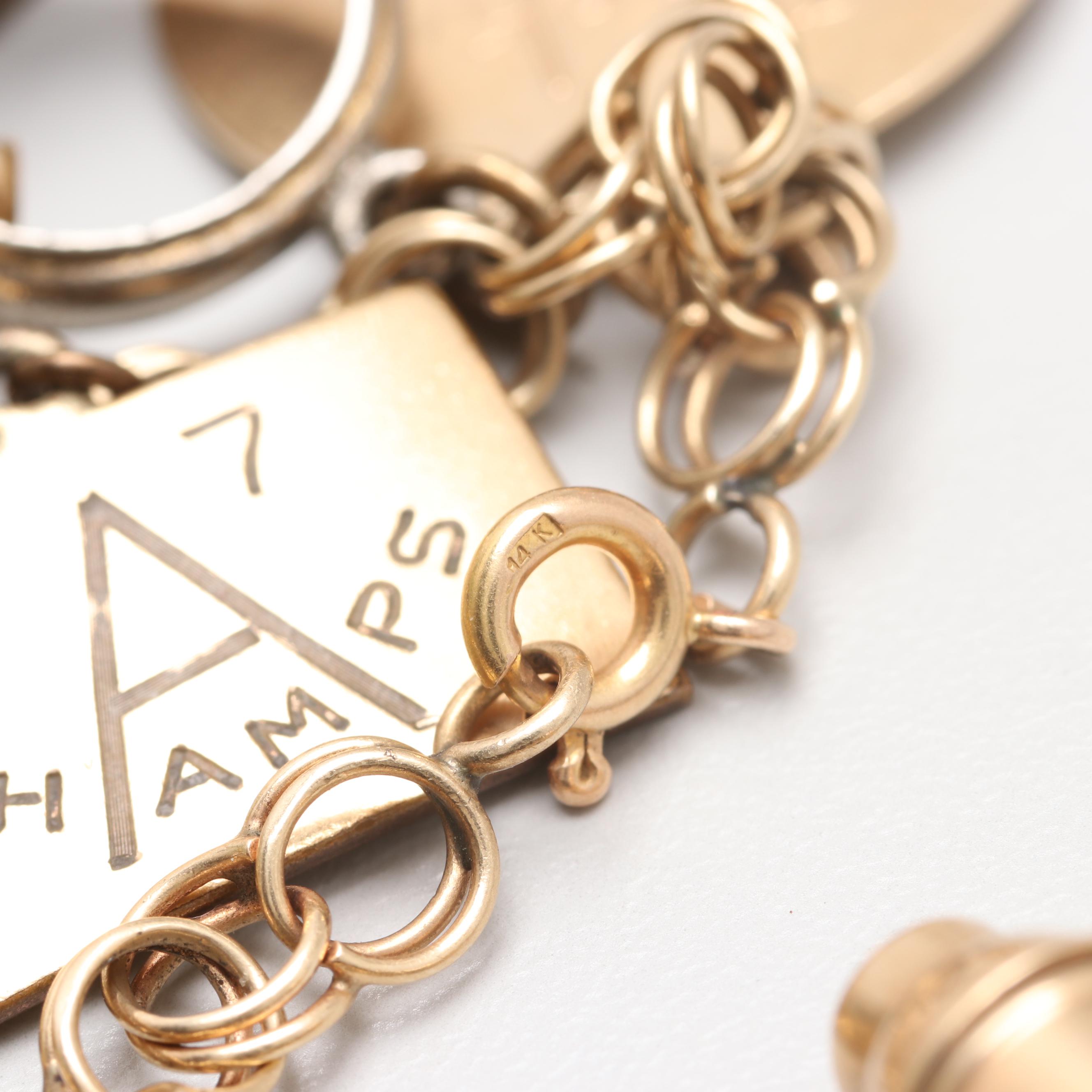 14K Yellow Gold Charm Bracelet with 14K, 10K Yellow Gold and Gold Tone Charms
