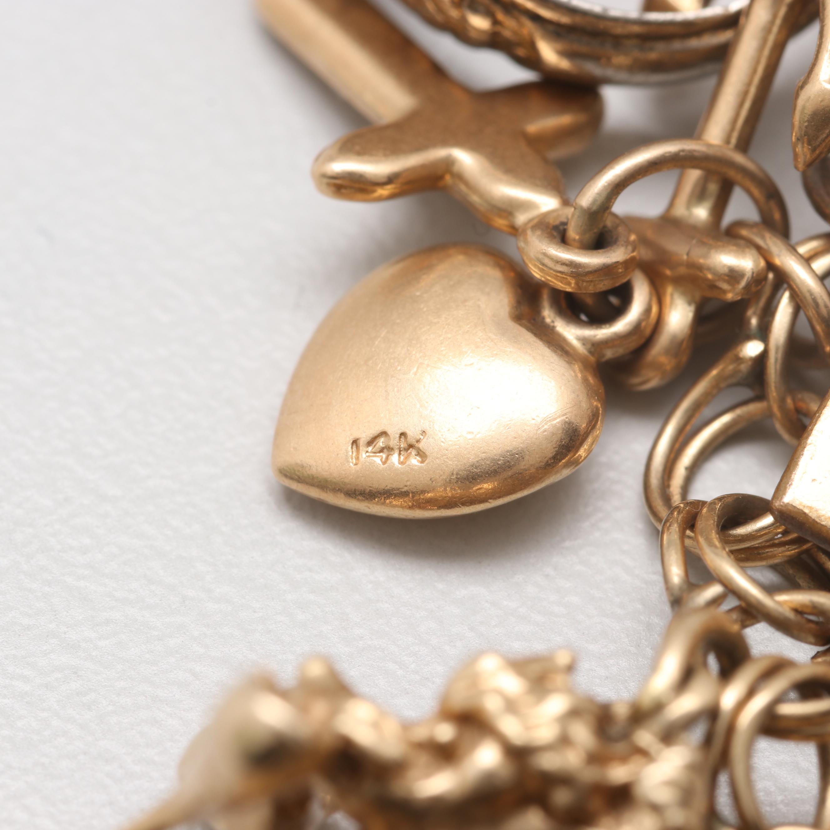 14K Yellow Gold Charm Bracelet with 14K, 10K Yellow Gold and Gold Tone Charms