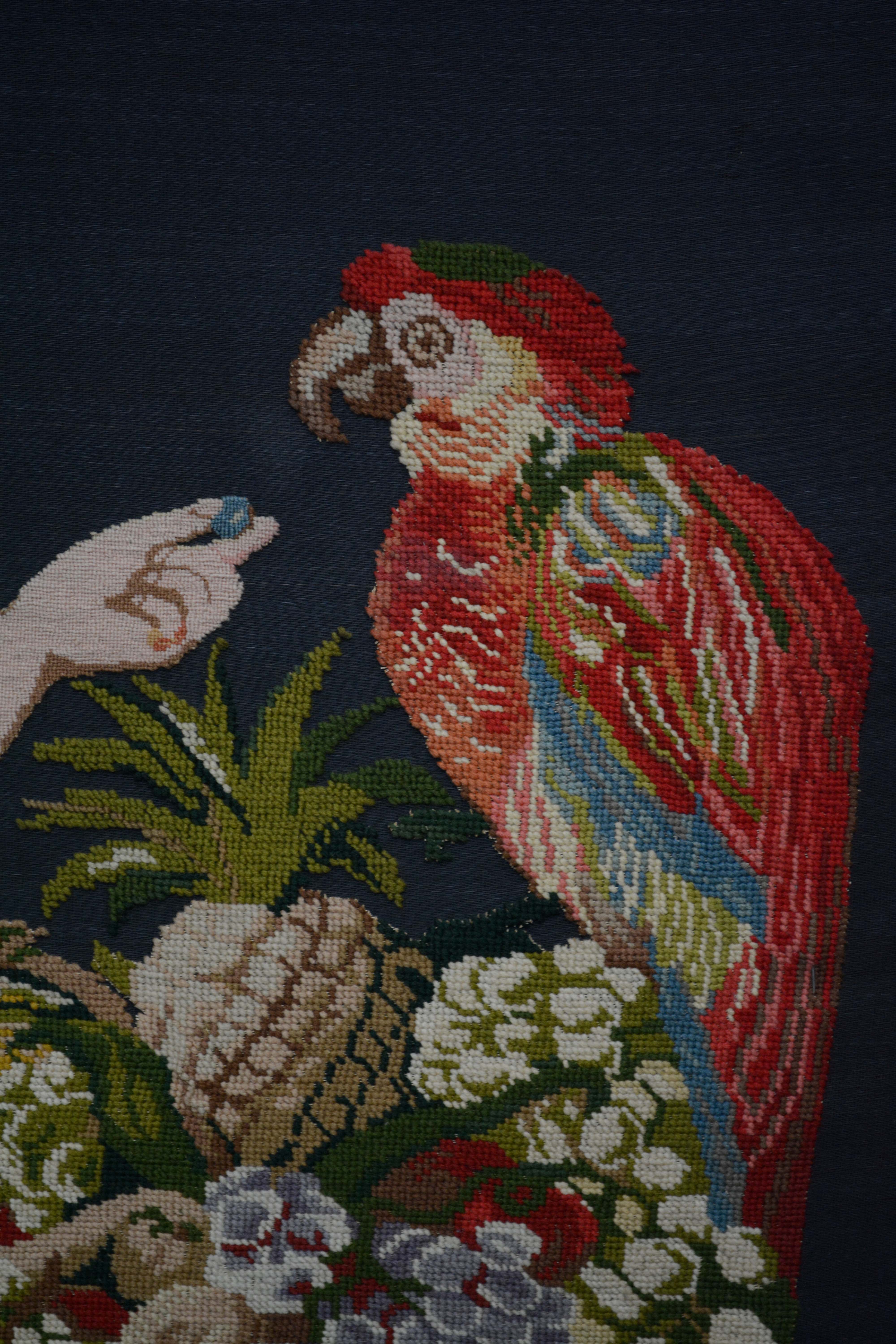 Needlepoint of Woman Feeding a Parrot