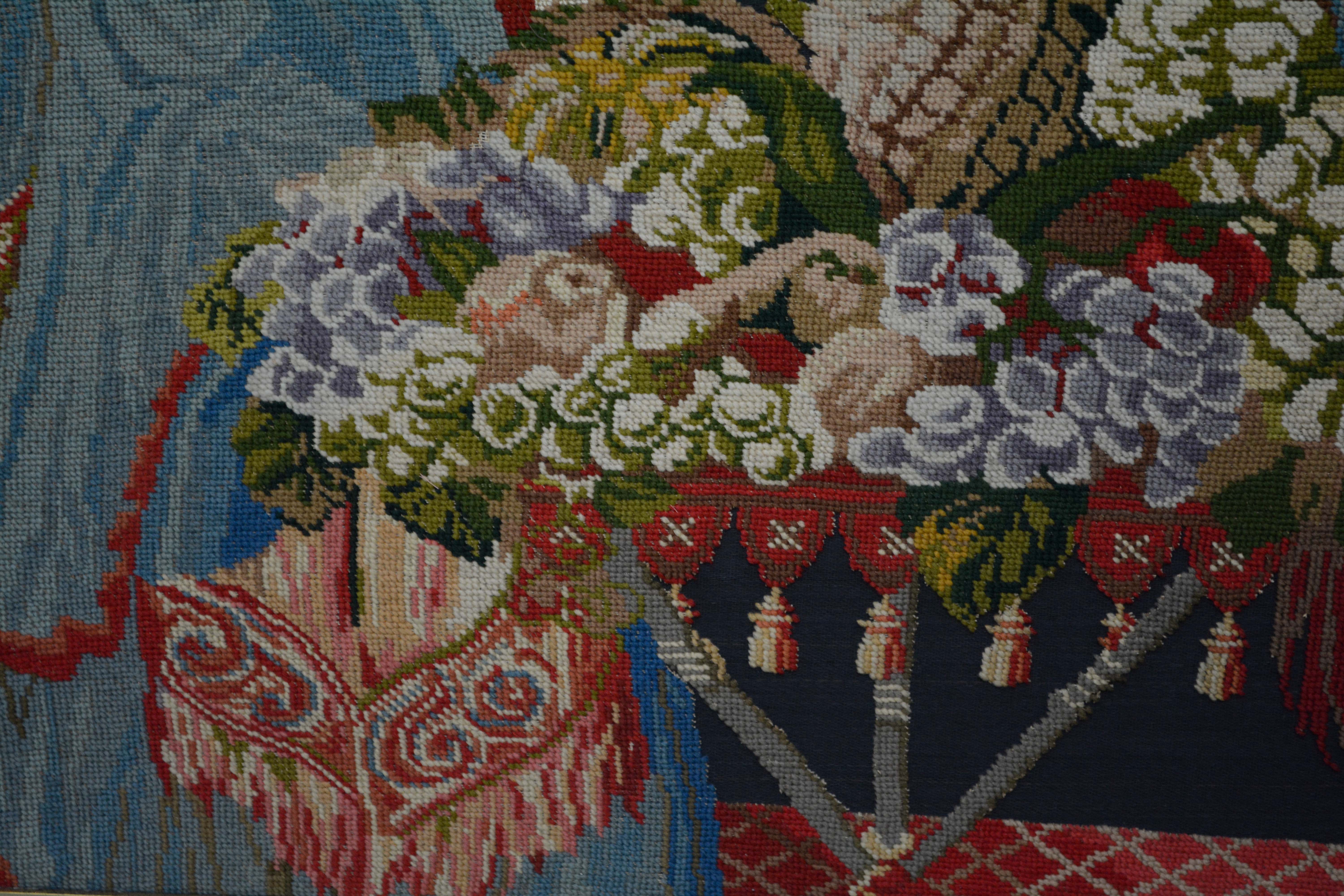 Needlepoint of Woman Feeding a Parrot