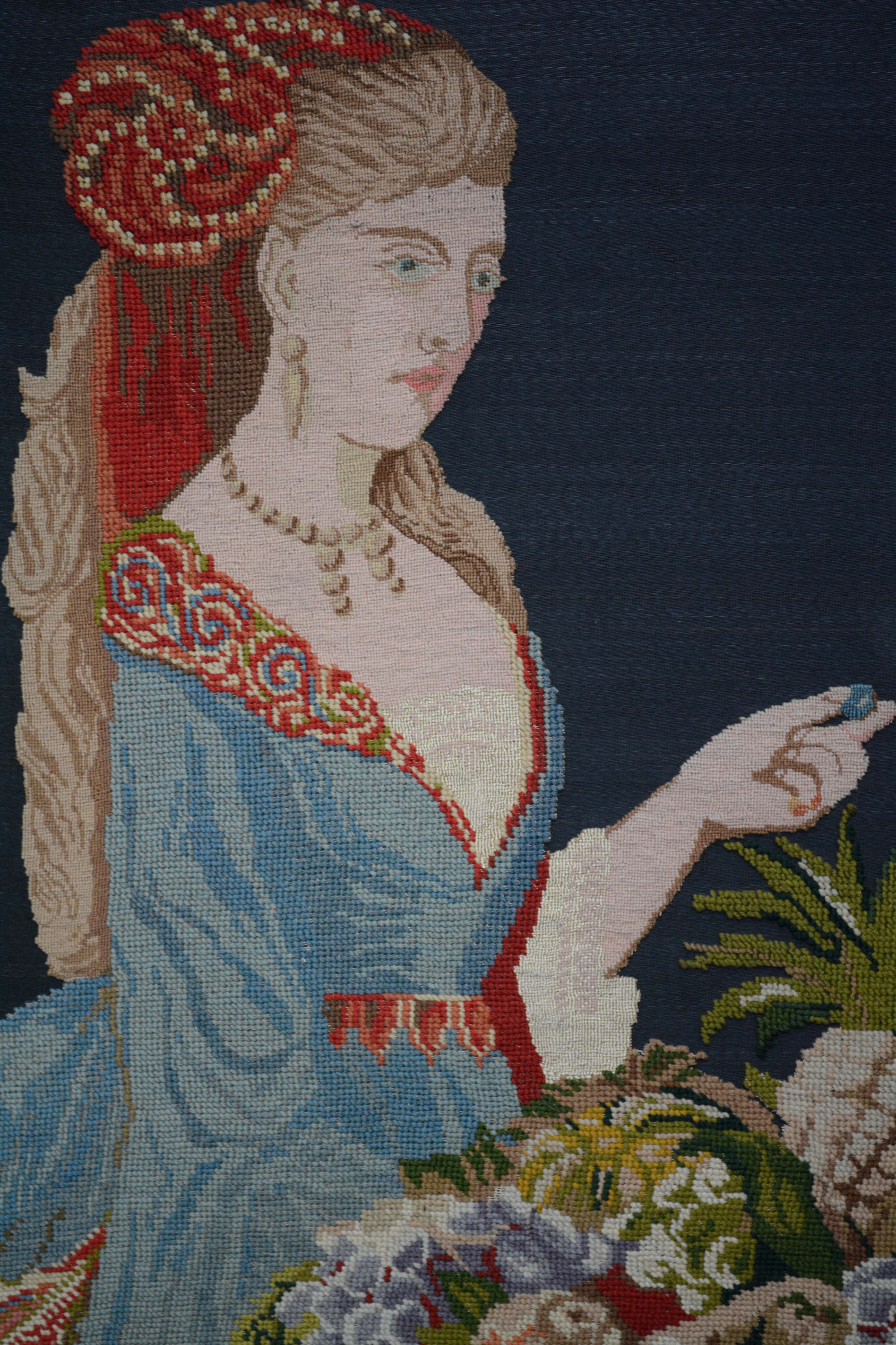 Needlepoint of Woman Feeding a Parrot