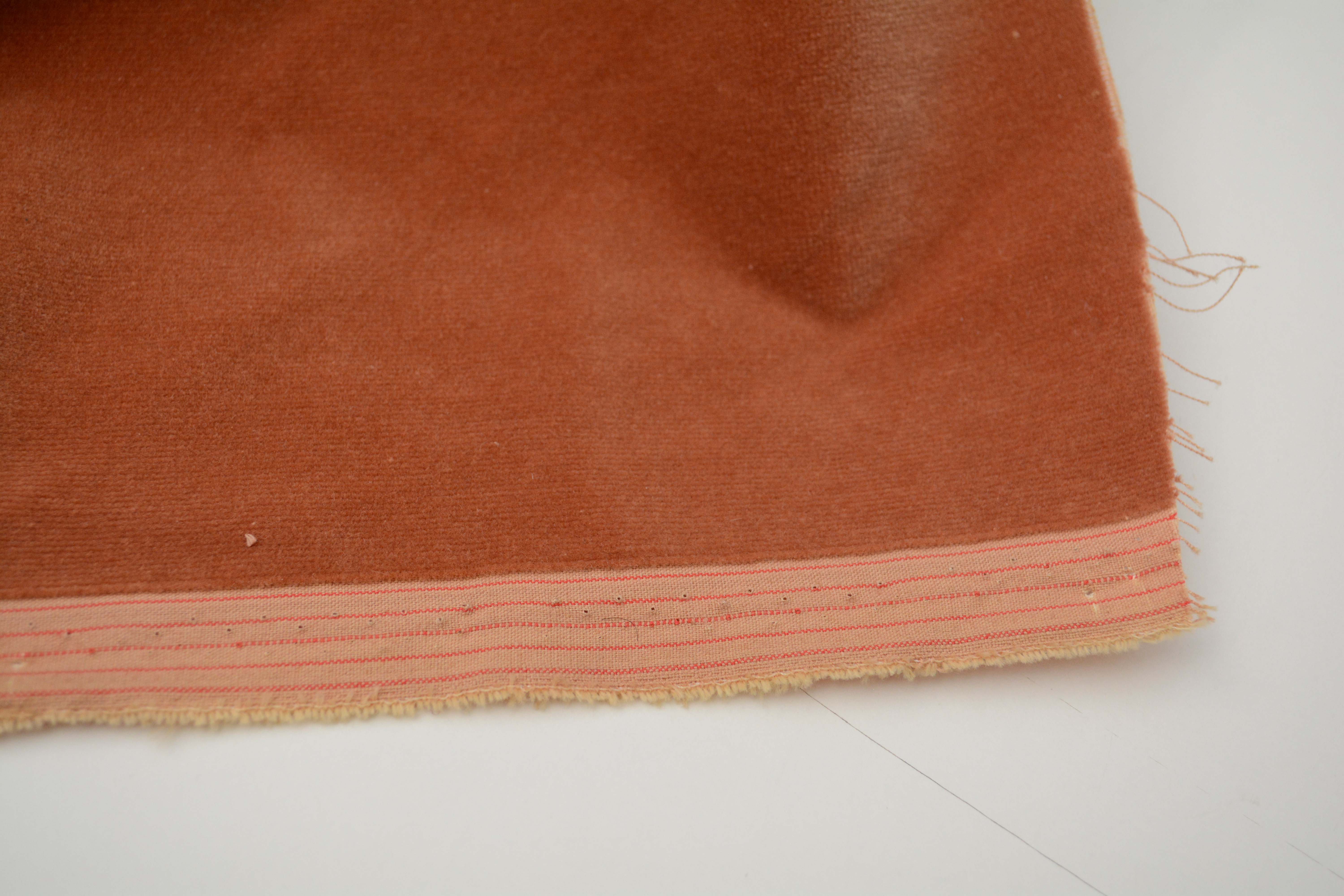 Tan and Red Velour Fabric Bolts