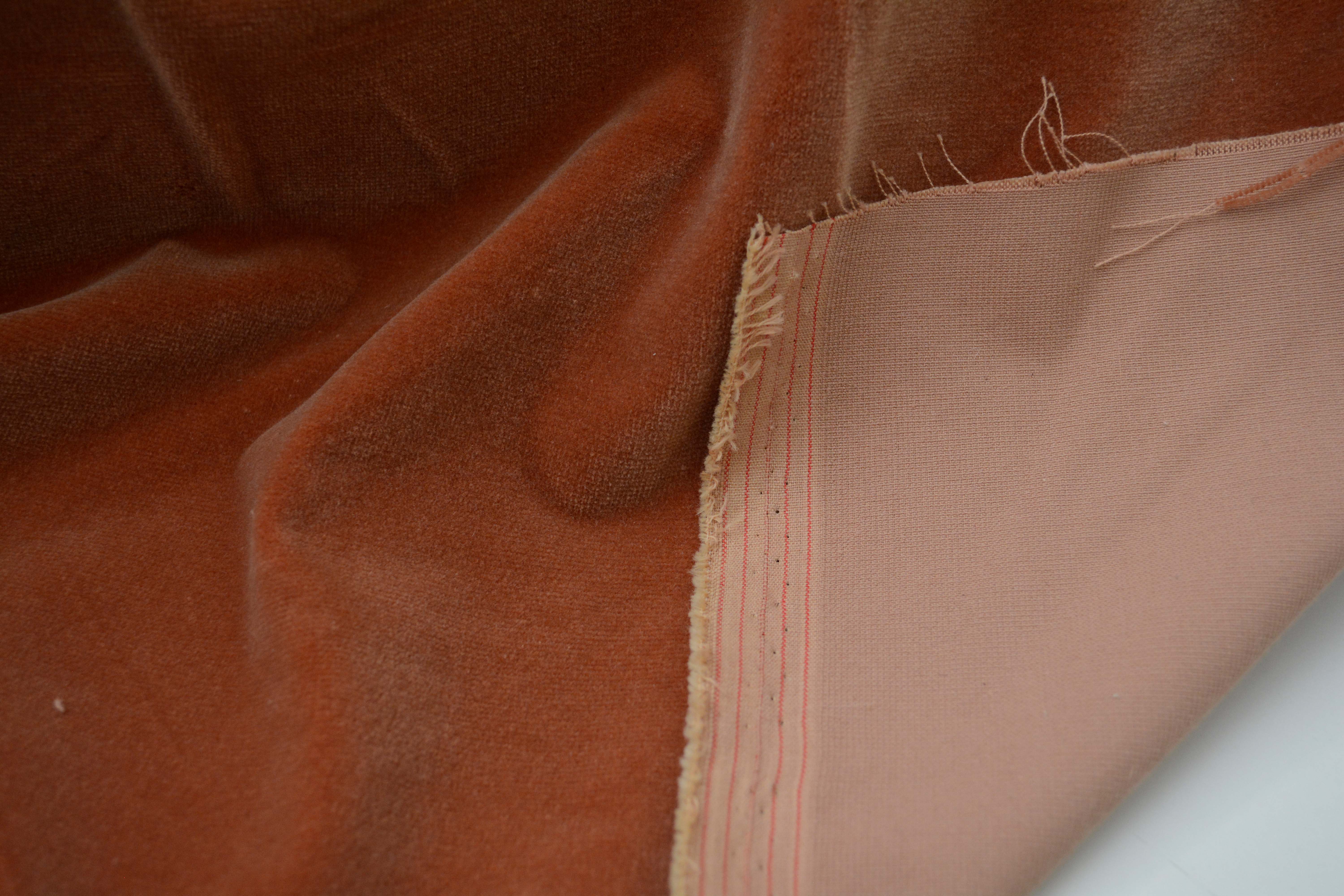 Tan and Red Velour Fabric Bolts