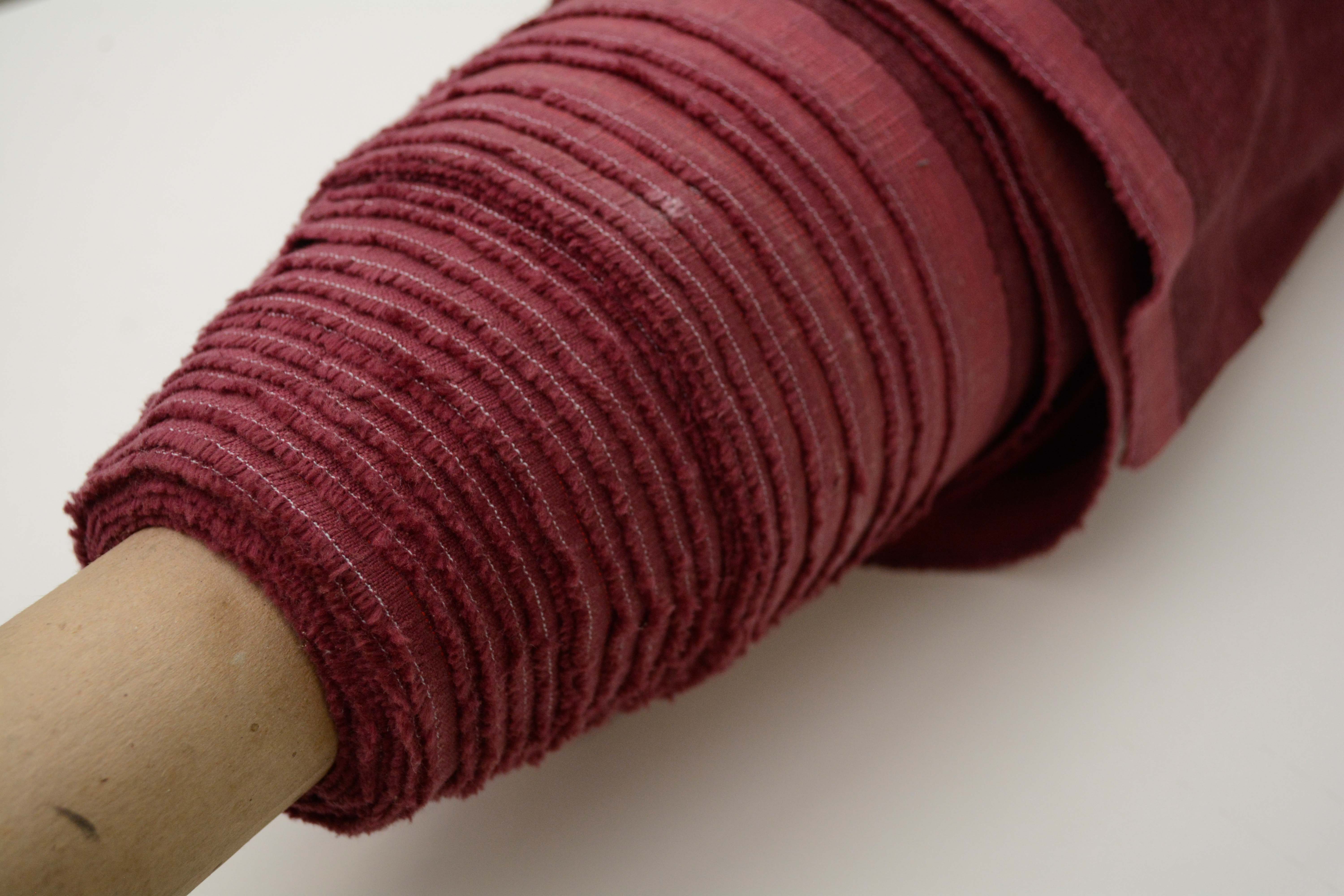 Tan and Red Velour Fabric Bolts