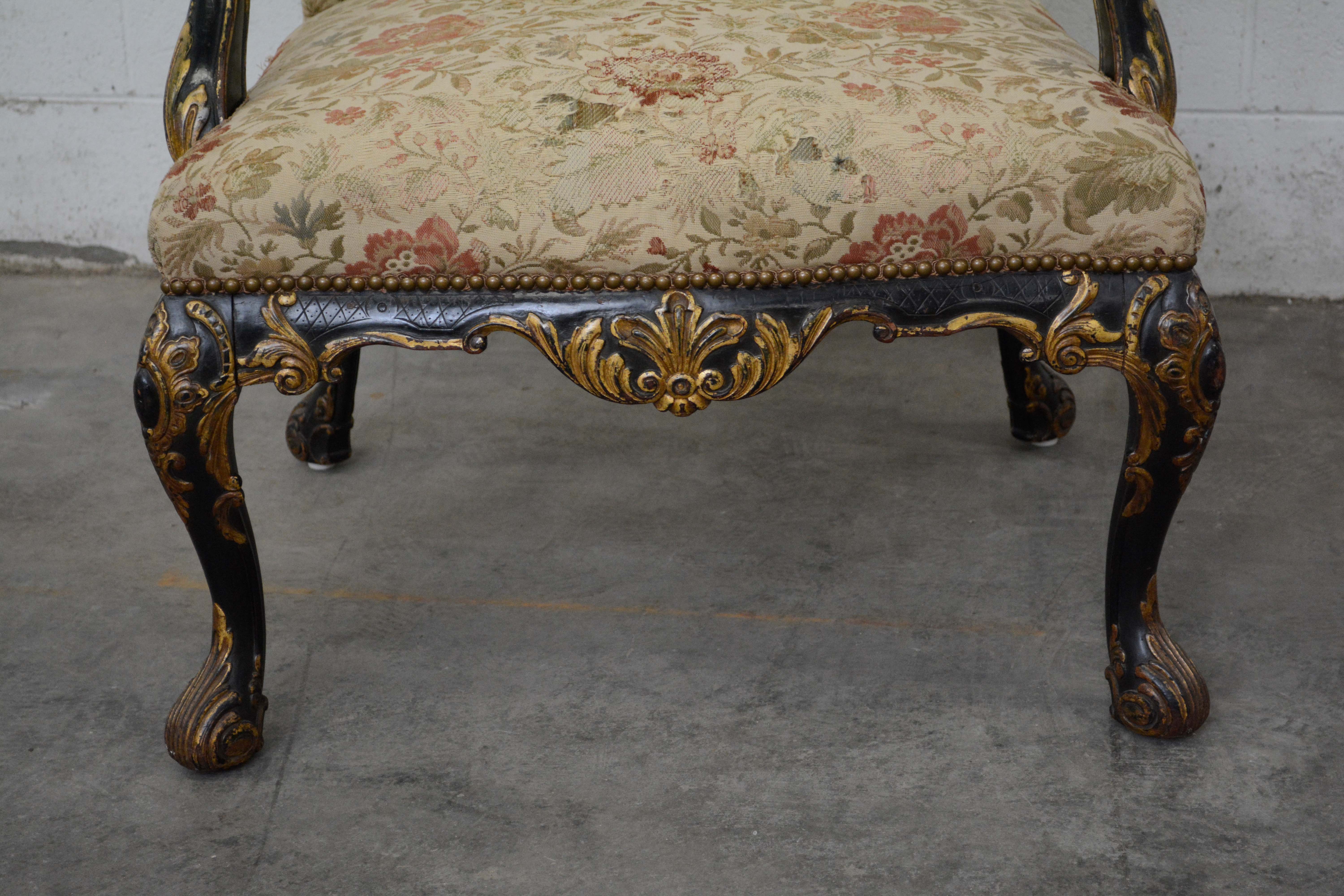 George II Style Ebonized and Parcel-Gilt Wingback Armchair, 20th Century