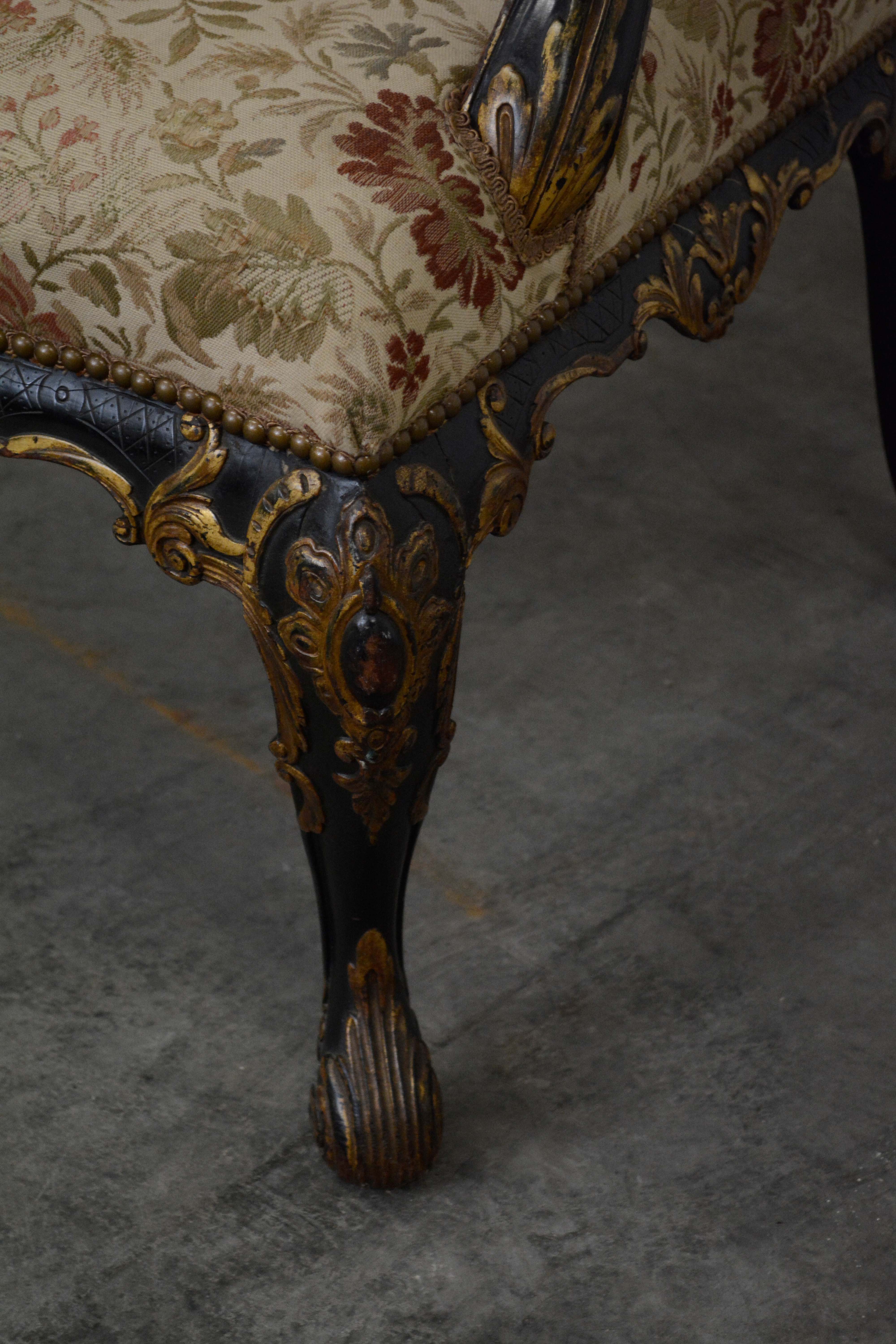 George II Style Ebonized and Parcel-Gilt Wingback Armchair, 20th Century